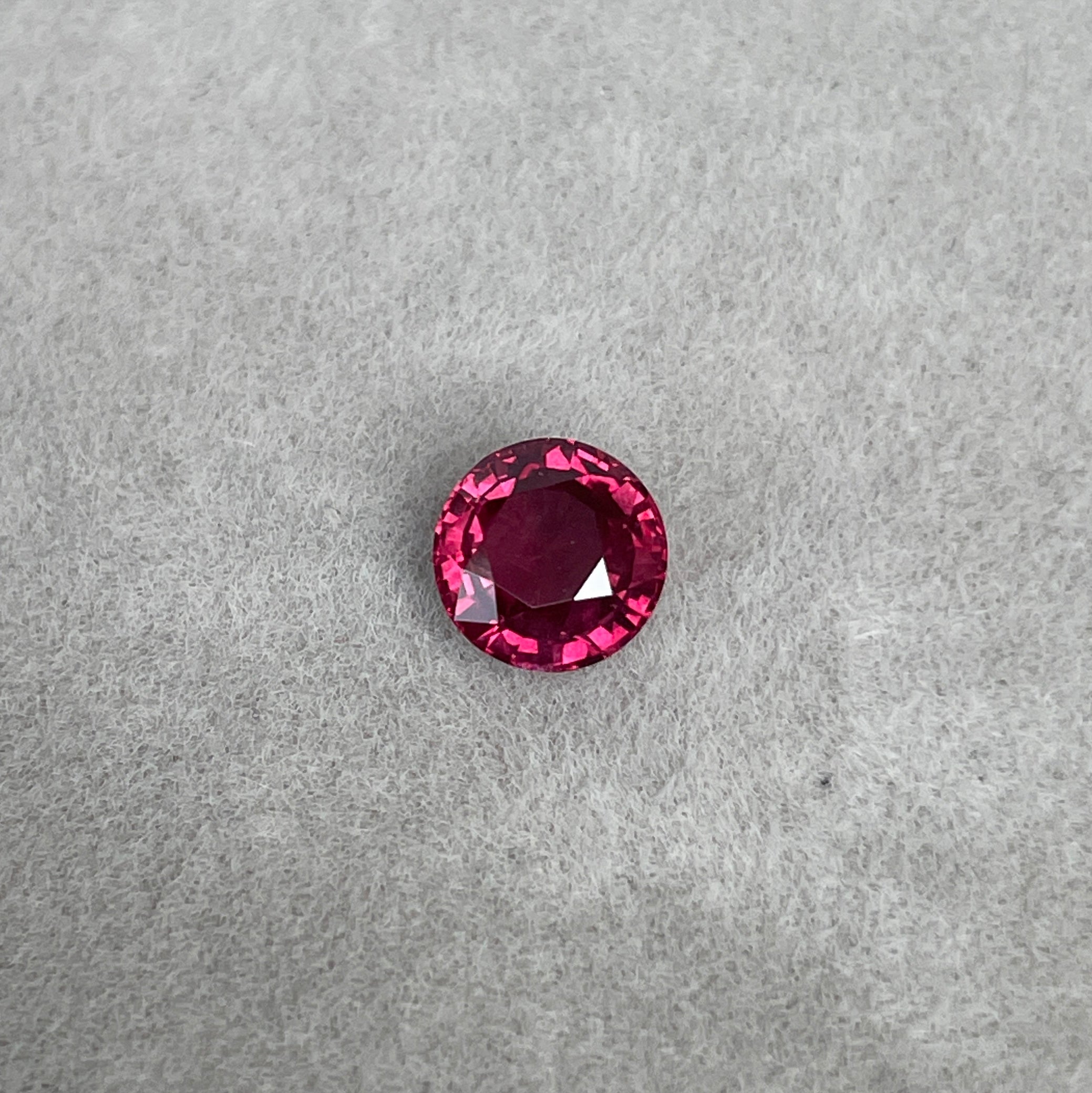 Loose natural ruby in pigeon blood red color under natural ligh