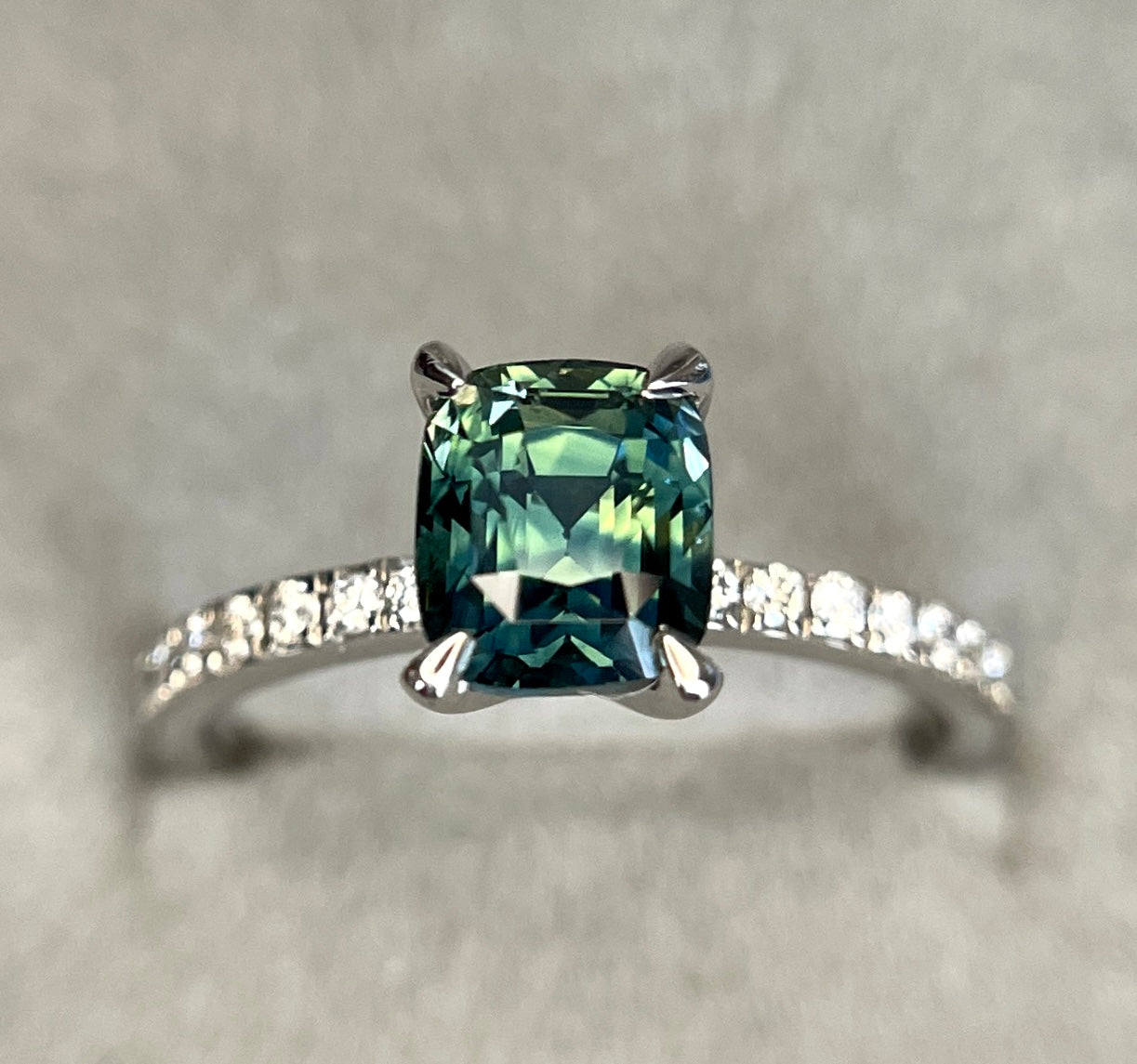 teal sapphire with diamonds in white gold