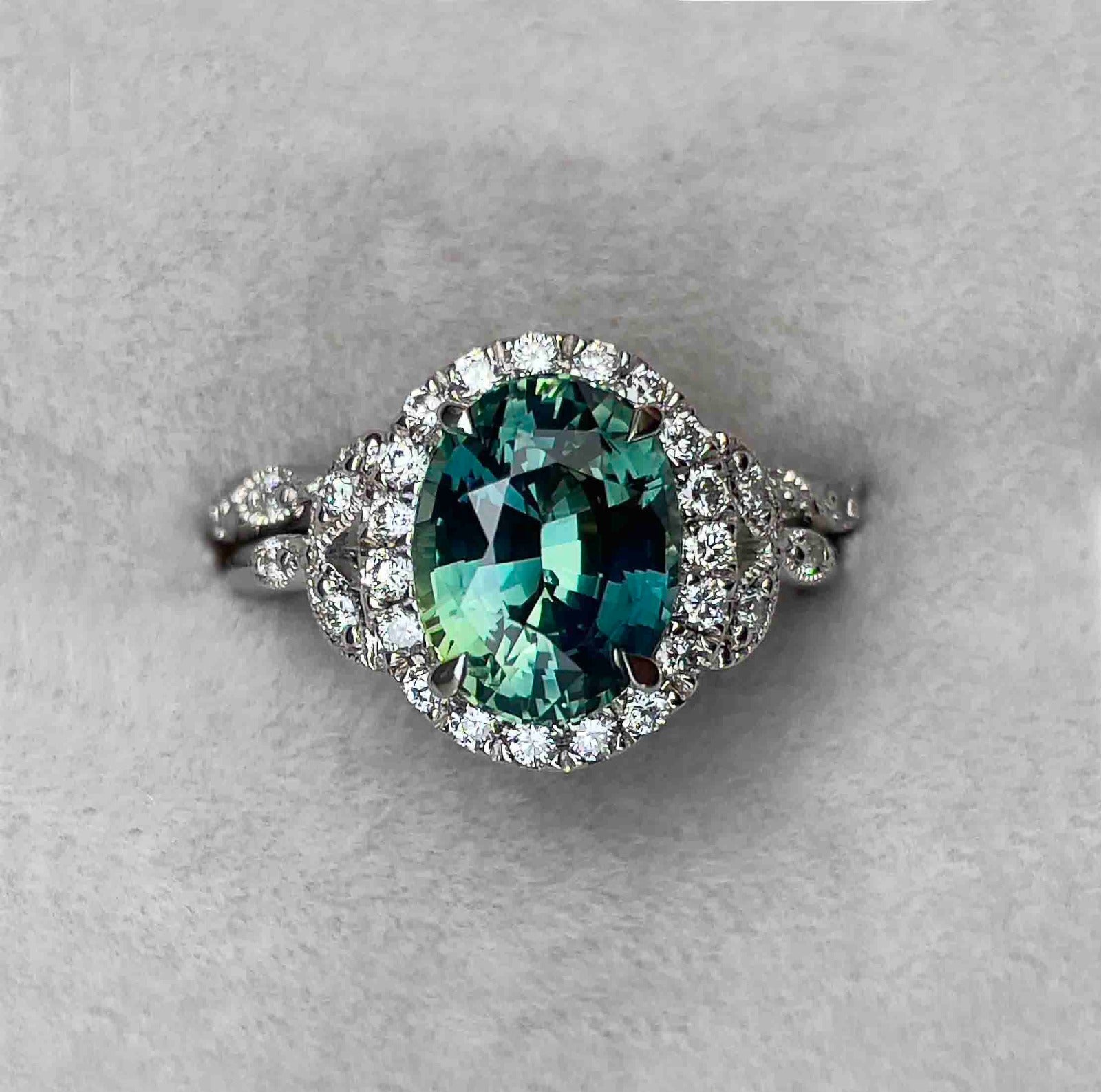 teal sapphire engagement ring with diamonds