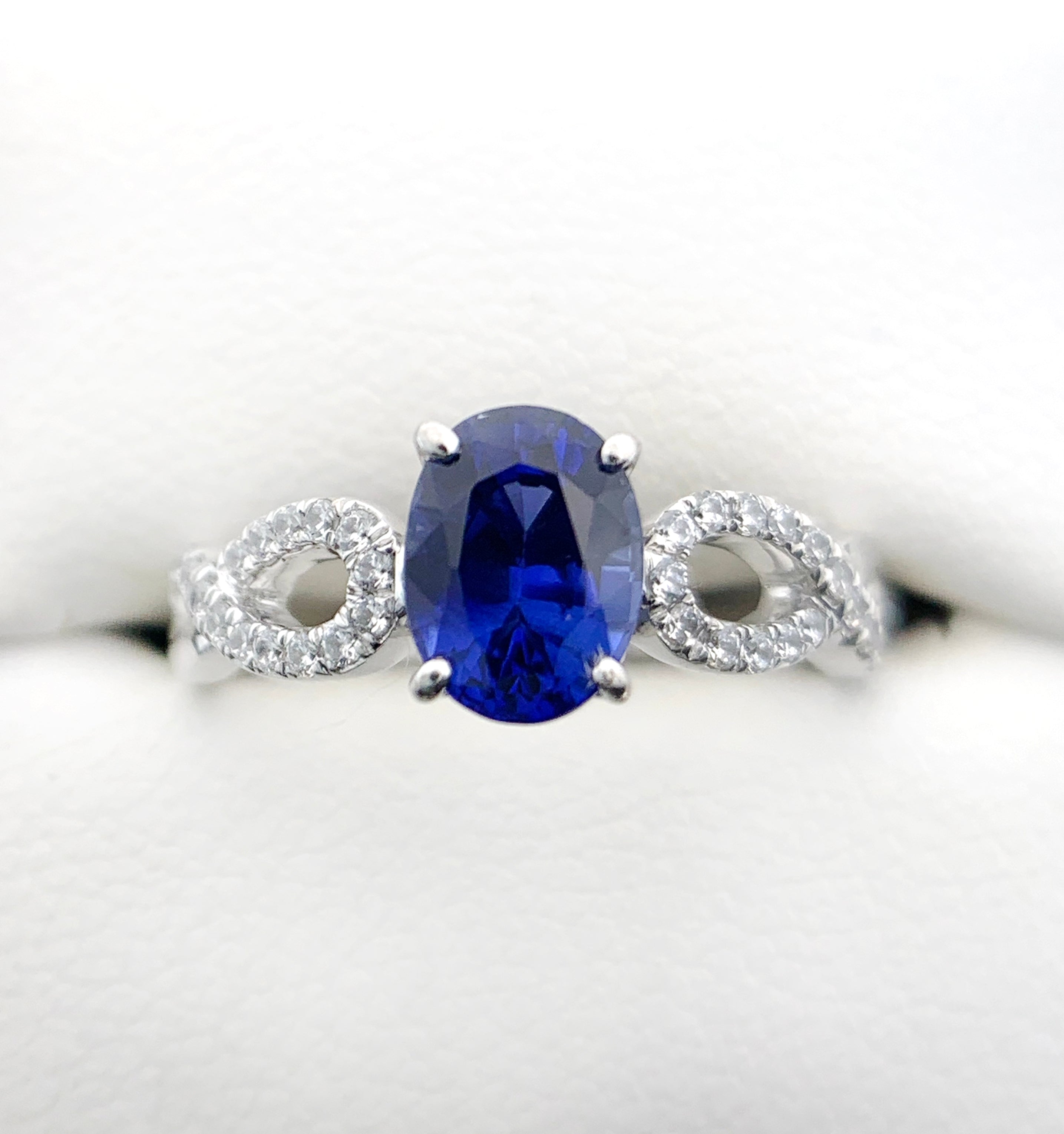 oval blue sapphire with diamonds in white gold