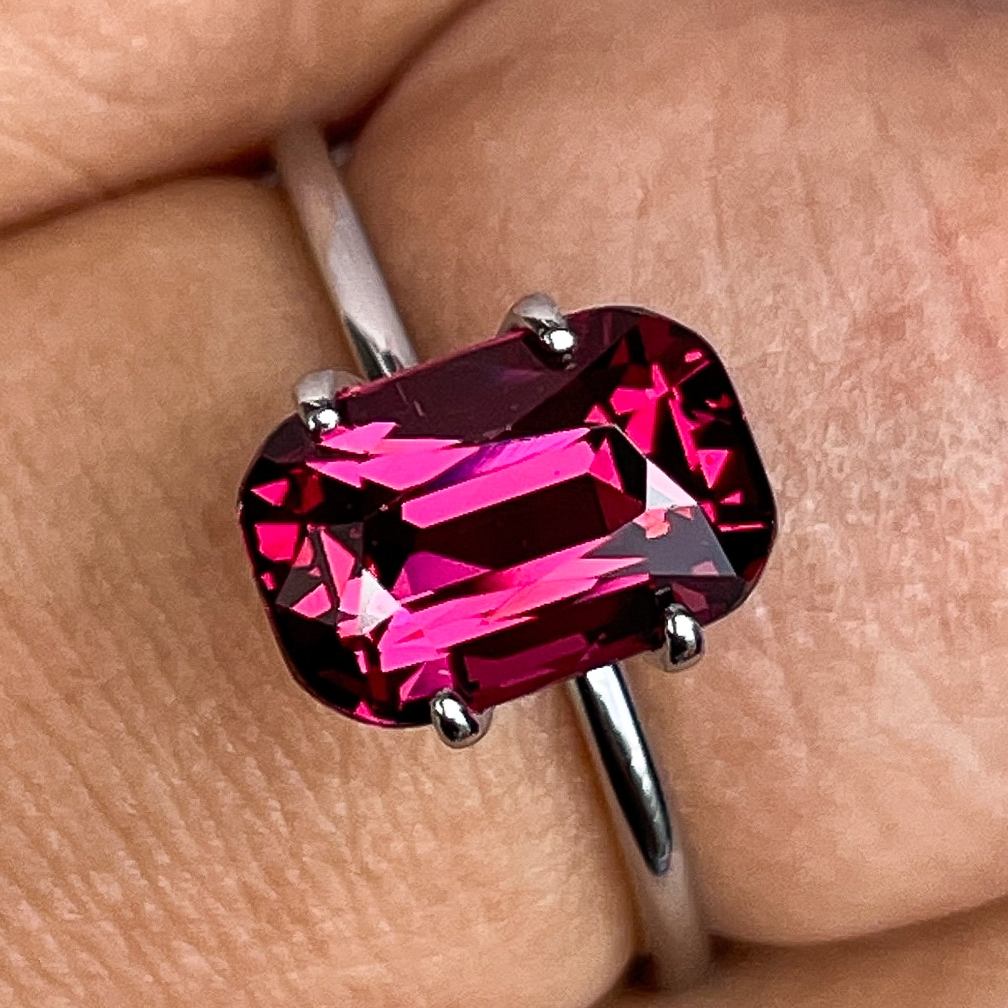 Natural Rhodolite Garnet 3.18 Ct cushion cut gemstone in raspberry red, VVS clarity, from NASHGEMS for engagement rings.