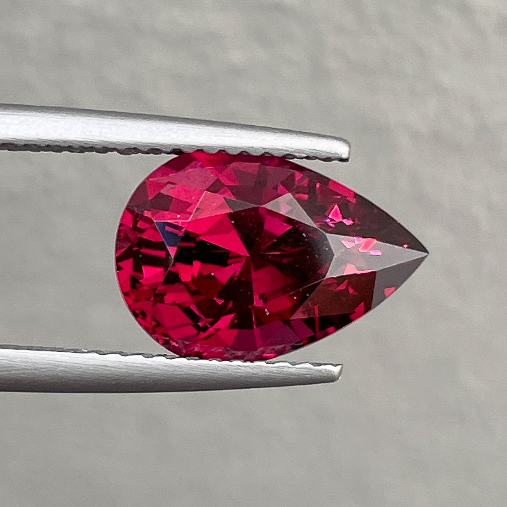 Natural Rhodolite Garnet 4.33 Ct pear-shaped loose gemstone with raspberry red color, ideal for engagement rings.