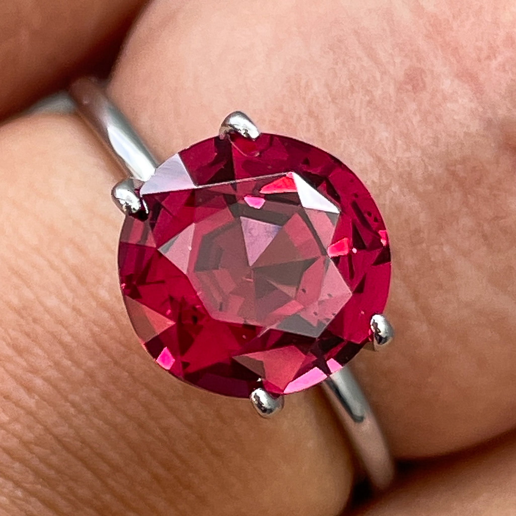 Natural Rhodolite Garnet 3.13 Ct round cut gemstone from NASHGEMS, showcasing a vibrant raspberry red color and VVS clarity.