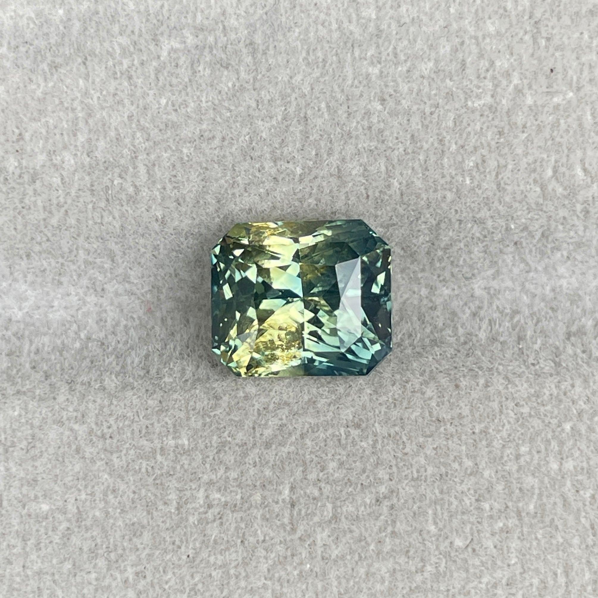 Teal sapphire loose gemstone, 4.55 carats, radiant cut, vibrant blue-green color, suitable for jewelry making, by NASHGEMS.