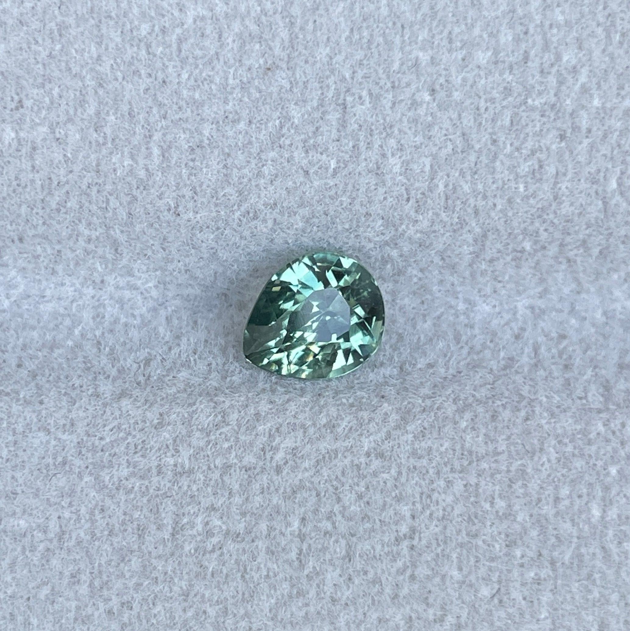 teal blue green parti sapphire pear drop cut gem