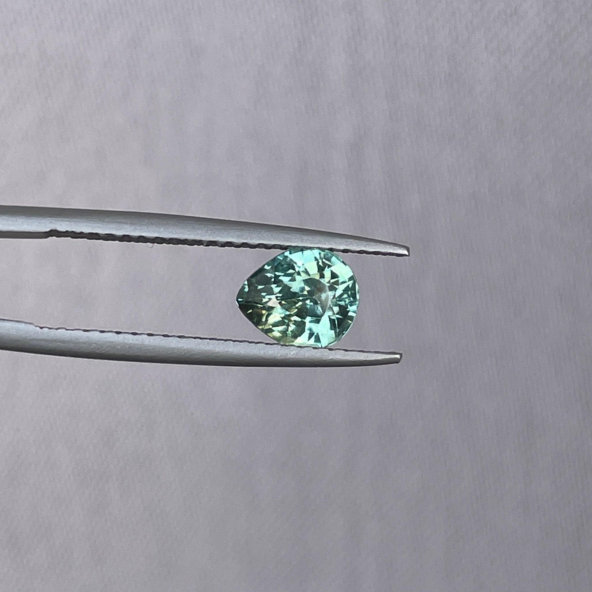 teal blue green parti sapphire pear drop cut gem