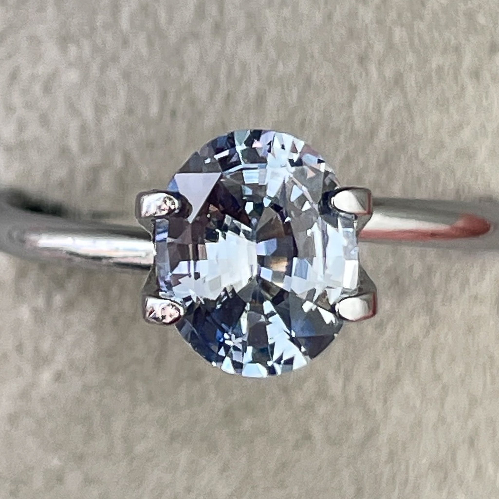 Natural Ceylon Pale Blue Sapphire 1.56 Ct oval cut loose gemstone by NASHGEMS, ideal for engagement rings.