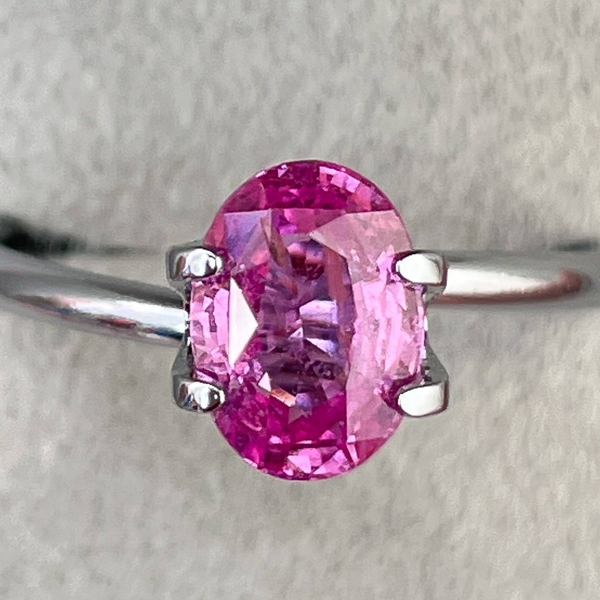 Natural pink sapphire loose gemstone, 1.65 Ct oval cut by NASHGEMS, ideal for engagement rings and jewelry making.
