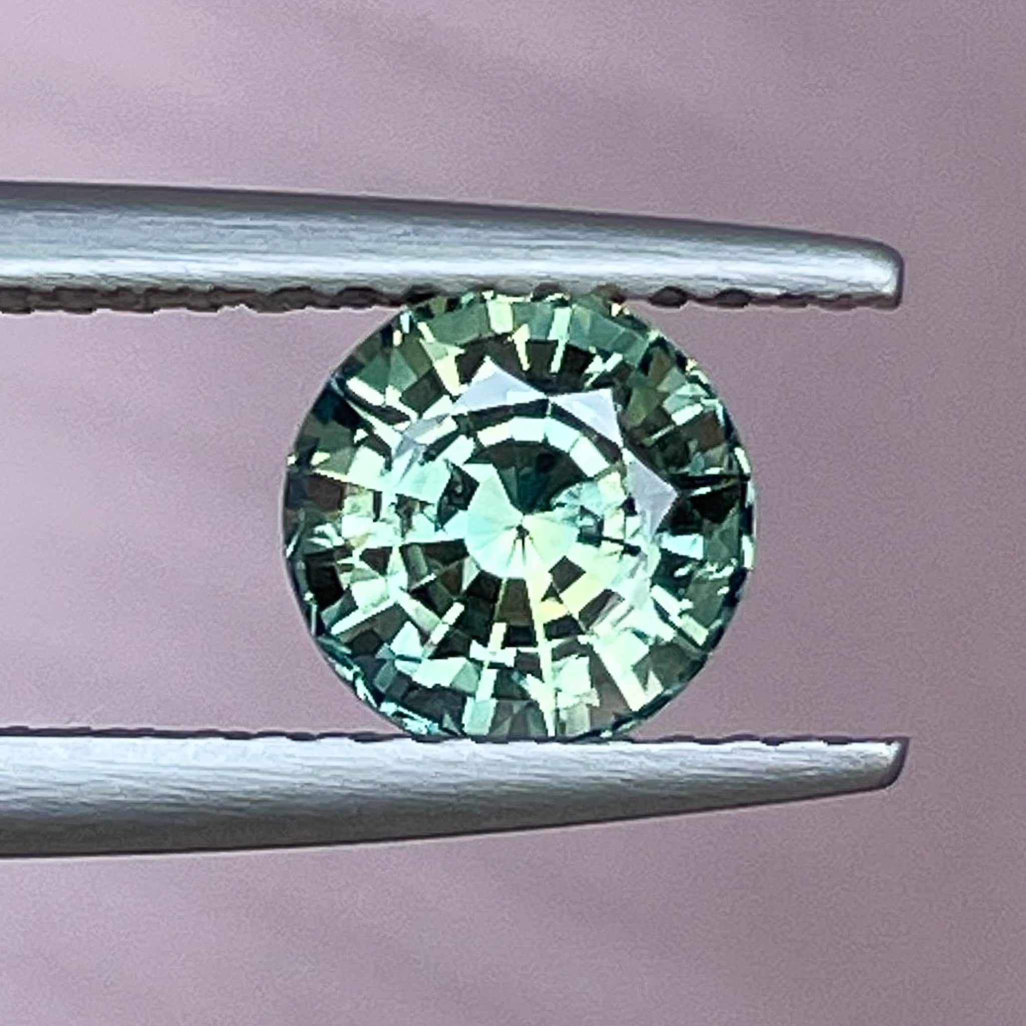 Natural green sapphire loose gemstone, 1.50 carats round cut teal sapphire by NASHGEMS for engagement or custom jewelry.