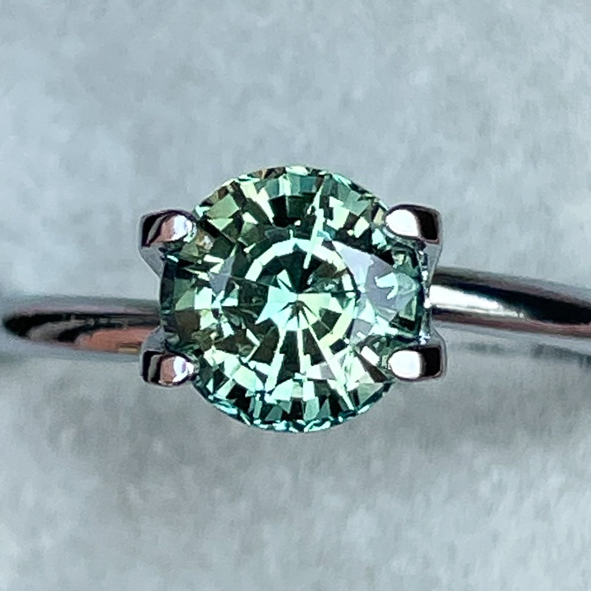 Natural green teal sapphire loose gemstone, 1.50 Ct round cut by NASHGEMS, ideal for engagement rings or custom jewelry.