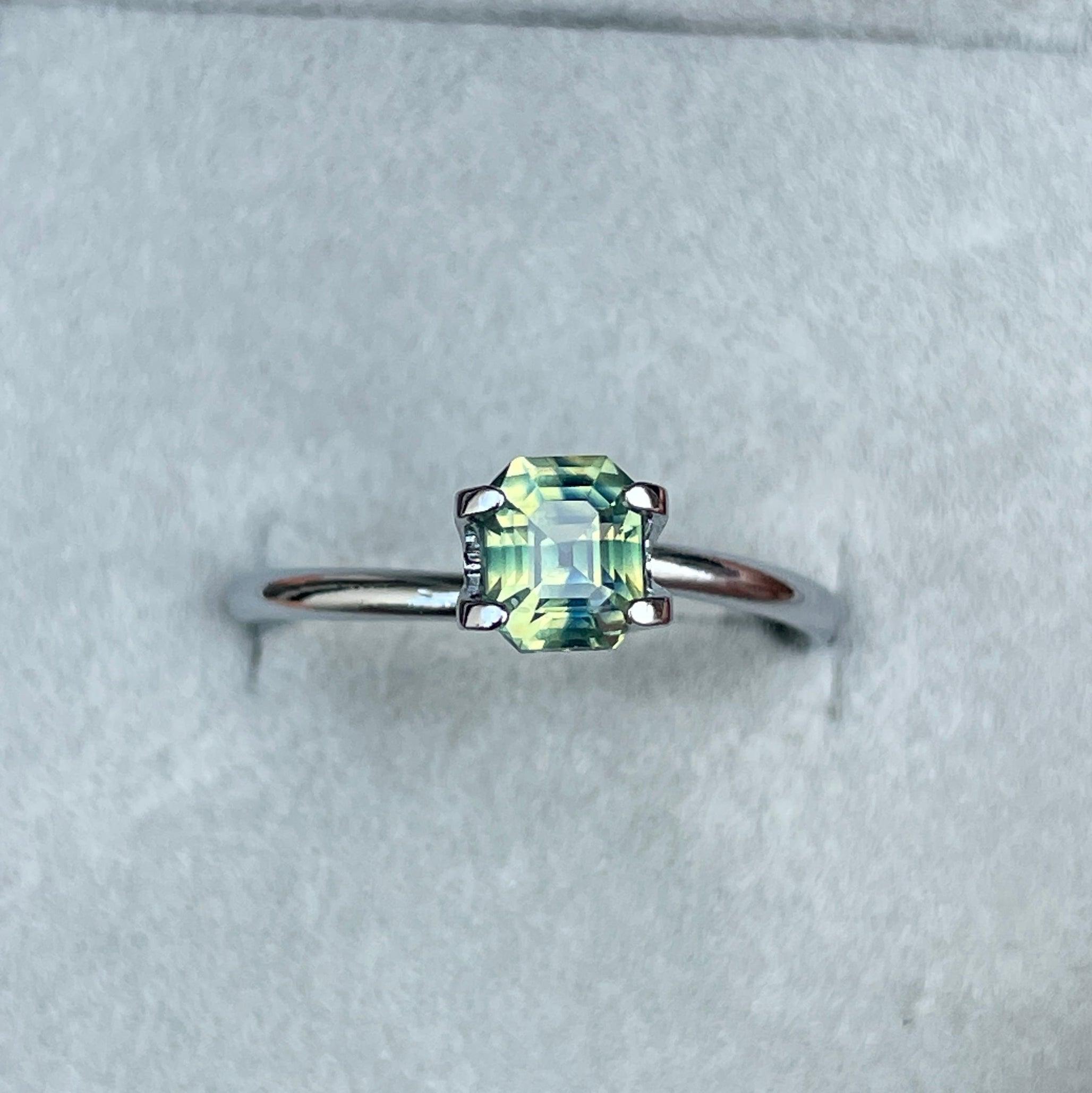 Teal bi-colored parti sapphire gemstone with emerald cut, 1.11 carats, loose precious stone from NASHGEMS for September birthstone.