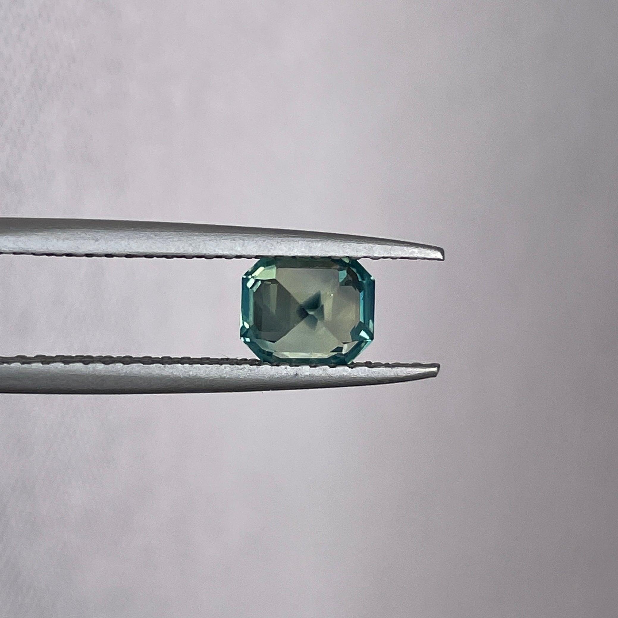 Teal bi-colored parti sapphire loose stone, emerald cut, 1.11 carats, vibrant green and blue for September birthstone by NASHGEMS.