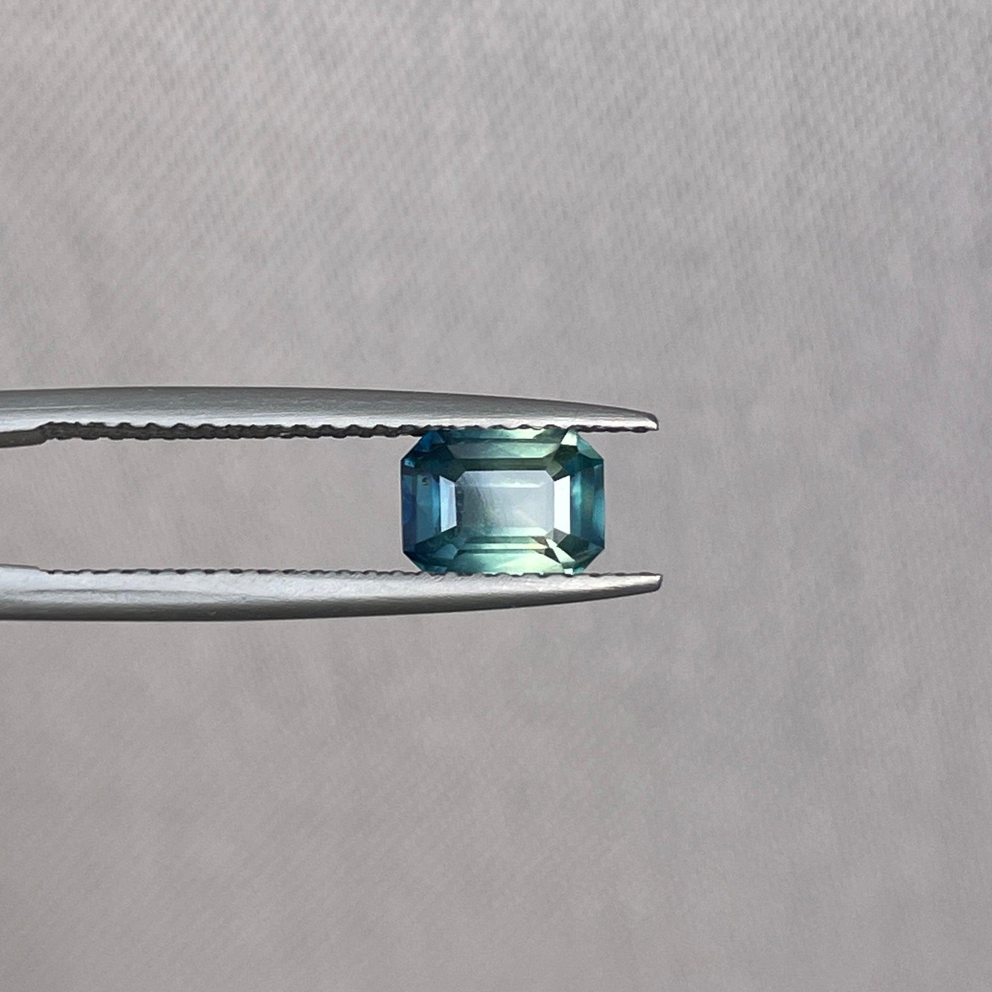 Teal bi-colored parti sapphire loose gemstone, 1.09 carats, vibrant green and blue shades, perfect for September birthstone jewelry.
