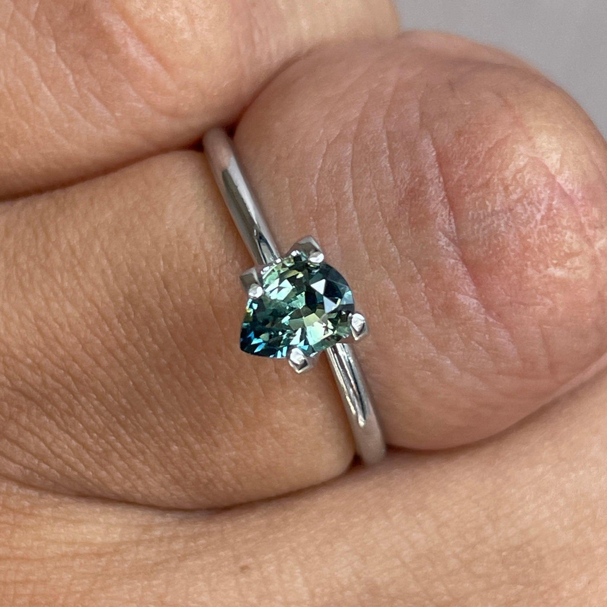 Teal bi-colored parti sapphire gemstone, 0.83 carats, loose precious stone by NASHGEMS, perfect for September birthstone jewelry.
