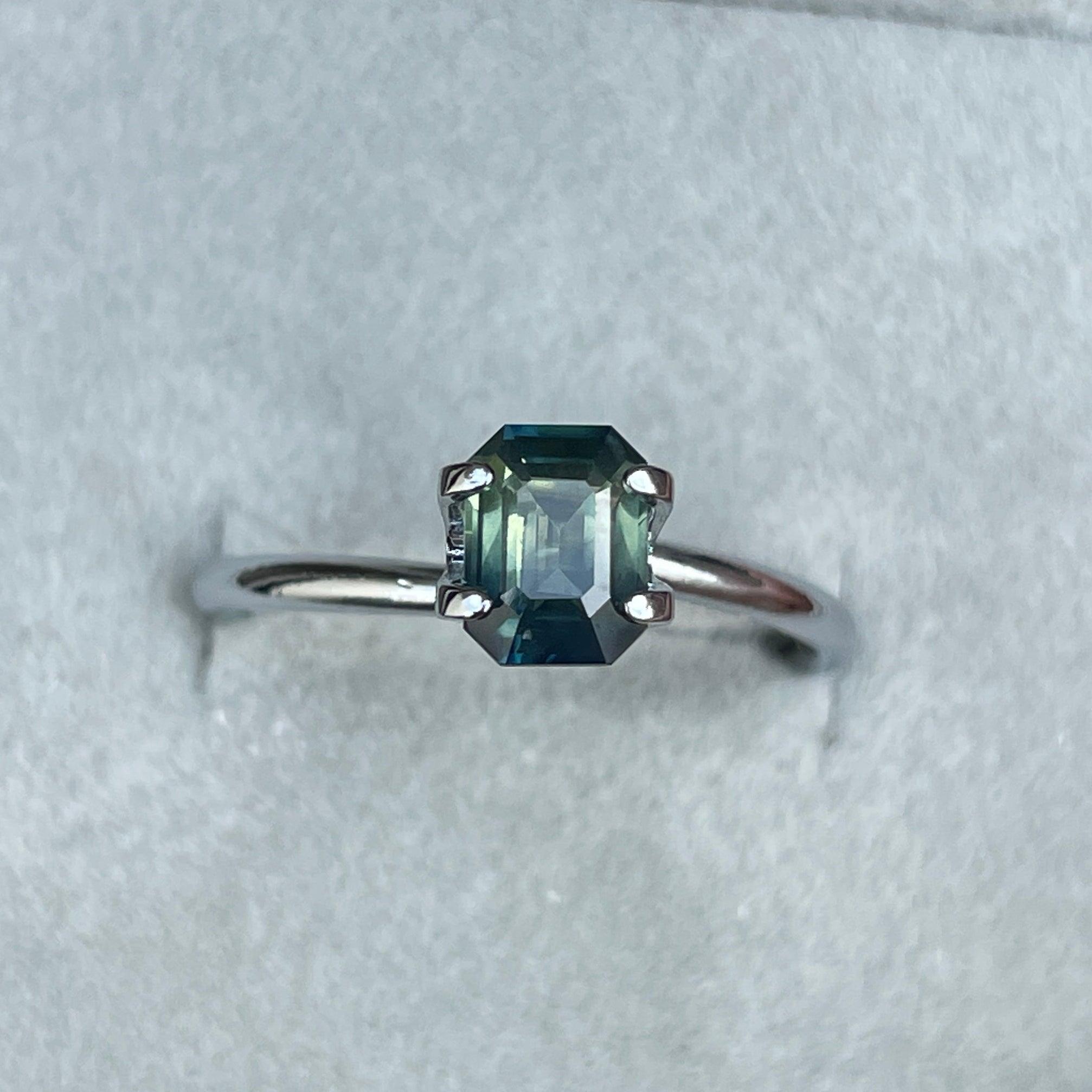 Teal bi-colored parti sapphire loose gemstone, 1.09 carats, vibrant green and blue hues, perfect for September birthstone jewelry.