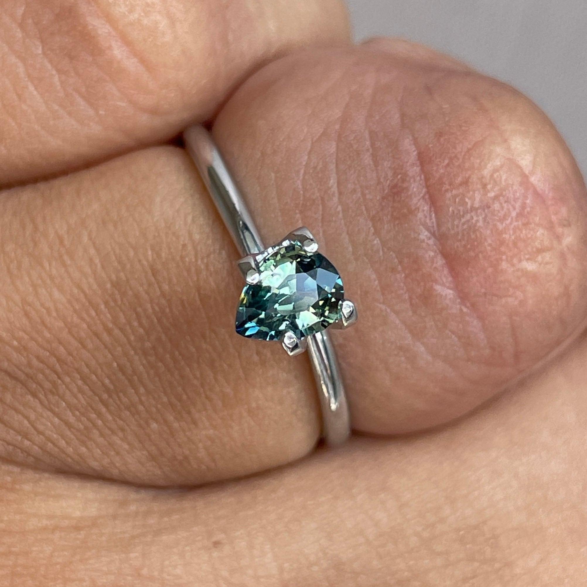 Bi-colored teal and green sapphire loose gemstone, 0.83 carats, showcasing vibrant September birthstone colors from NASHGEMS.