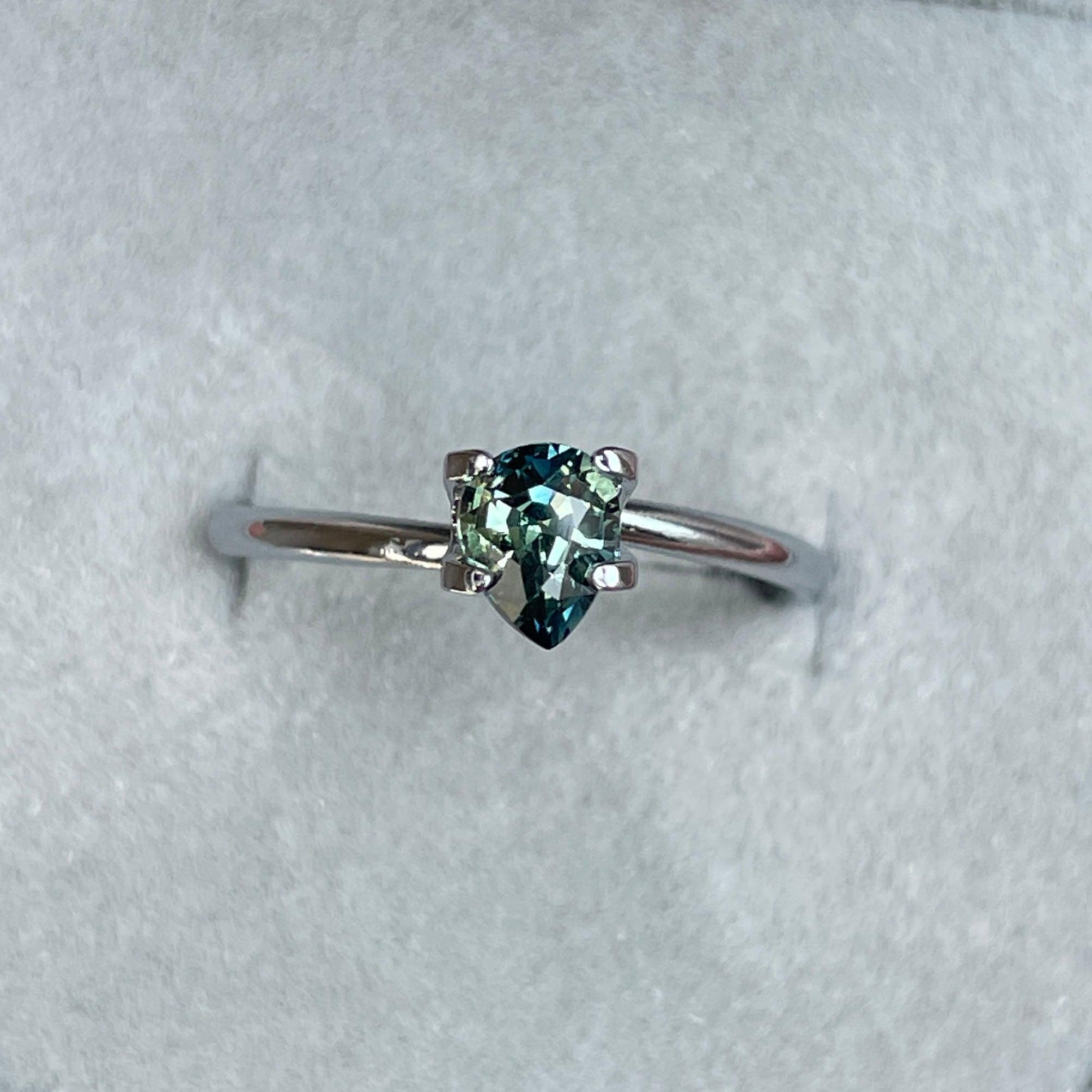 Teal bi-colored parti sapphire from NASHGEMS, 0.83 carats, loose precious gemstone with green and blue hues, perfect for September birthstone.