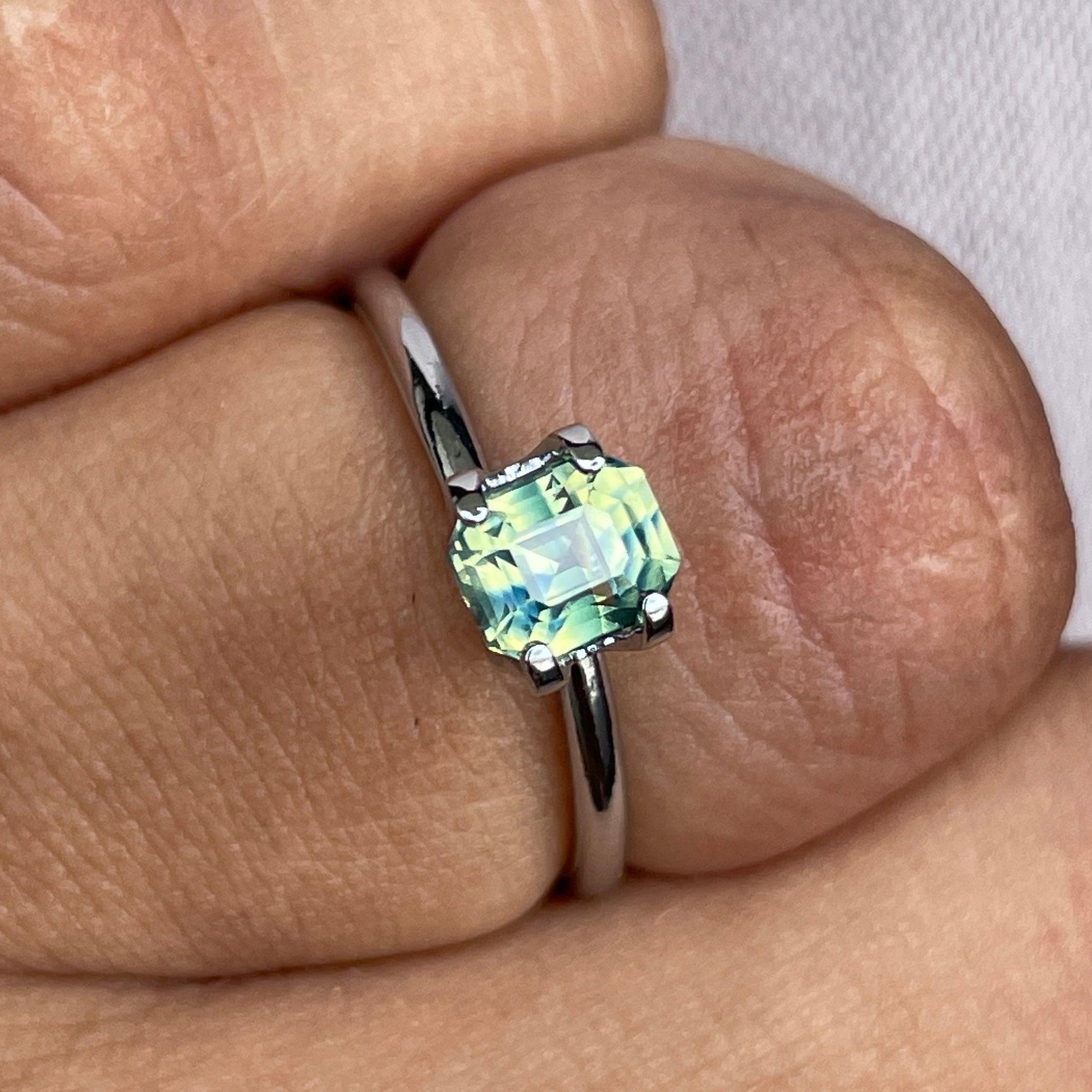 Teal sapphire loose gemstone with bi-colored parti sapphires, emerald cut, 1.11 carats, ideal for September birthstone jewelry.