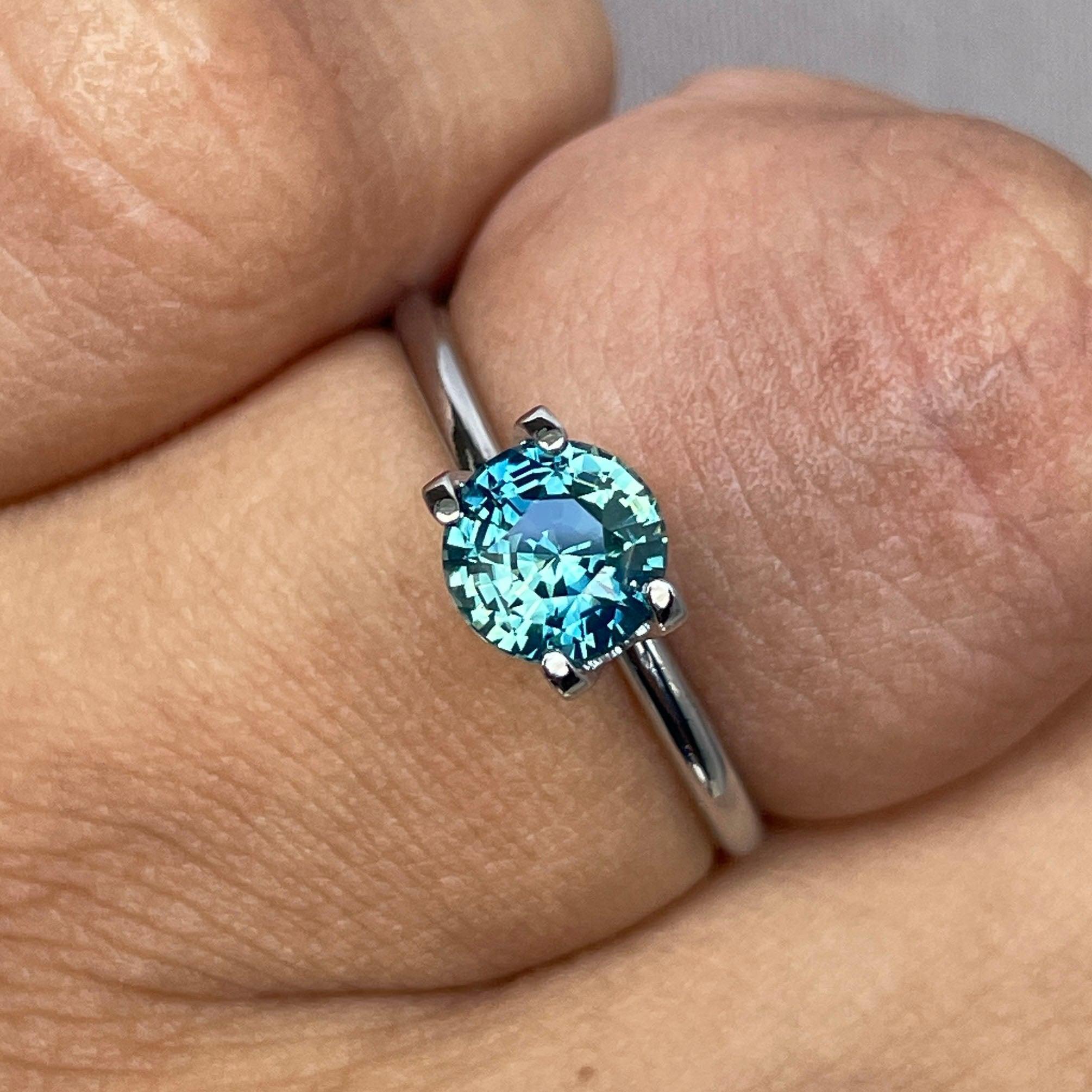 Teal blue and green bi-colored parti sapphire gemstone, 1.31 carats, round shape, loose birthstone for September, from NASHGEMS.