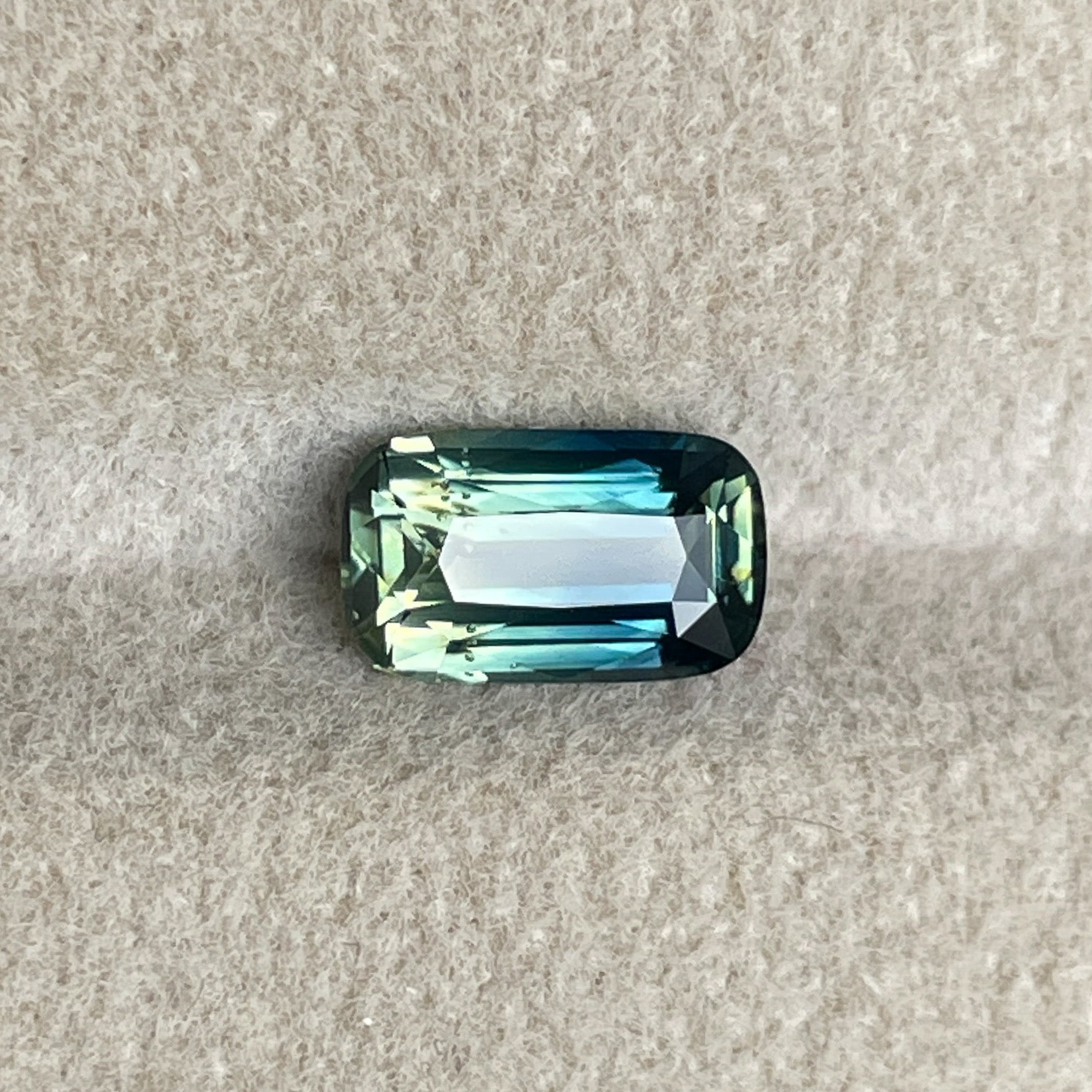Teal Natural Parti Bi Colour Sapphire 1.55 Ct elongated cushion cut, loose gemstone by NASHGEMS for engagement or custom jewelry.