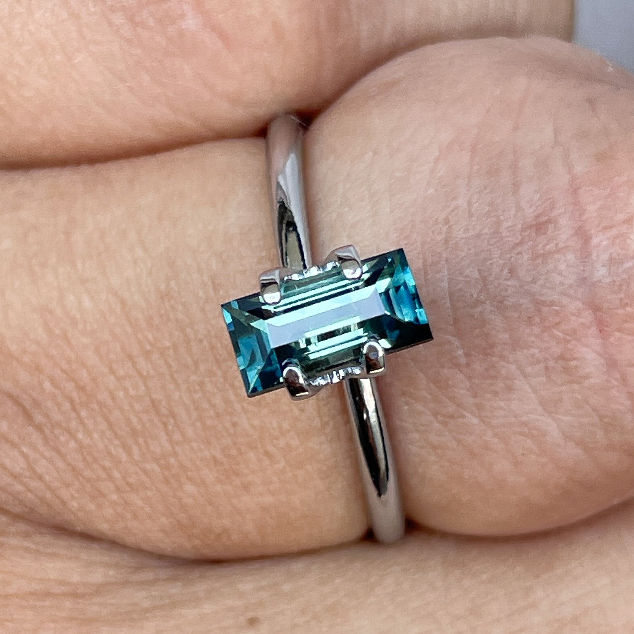 Teal sapphire 1.30 carat bicolour princess cut gemstone from NASHGEMS, perfect for building custom engagement rings or green jewelry.