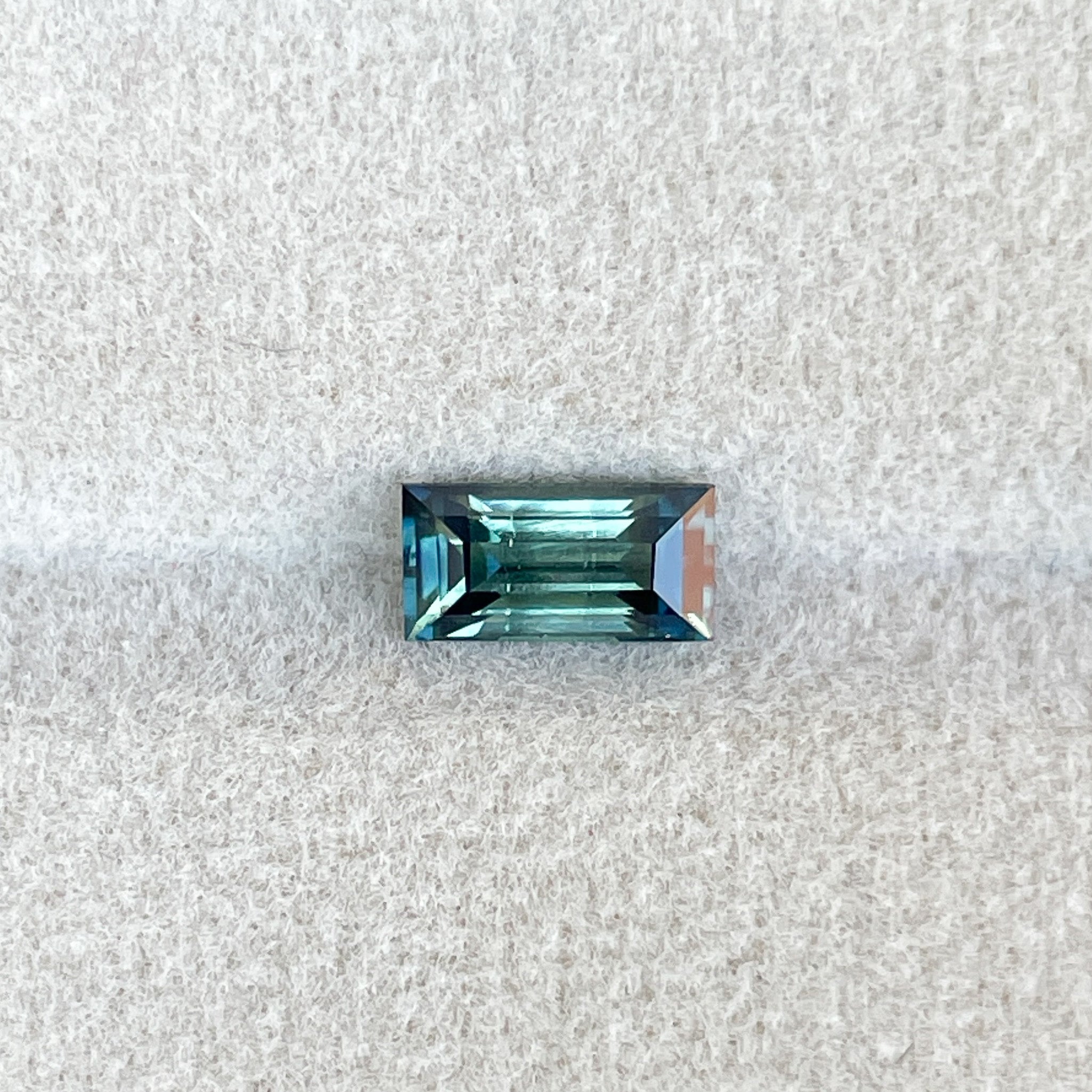 Teal sapphire 1.30 Ct bicolour princess cut gemstone from NASHGEMS, perfect for engagement rings or green jewelry designs.
