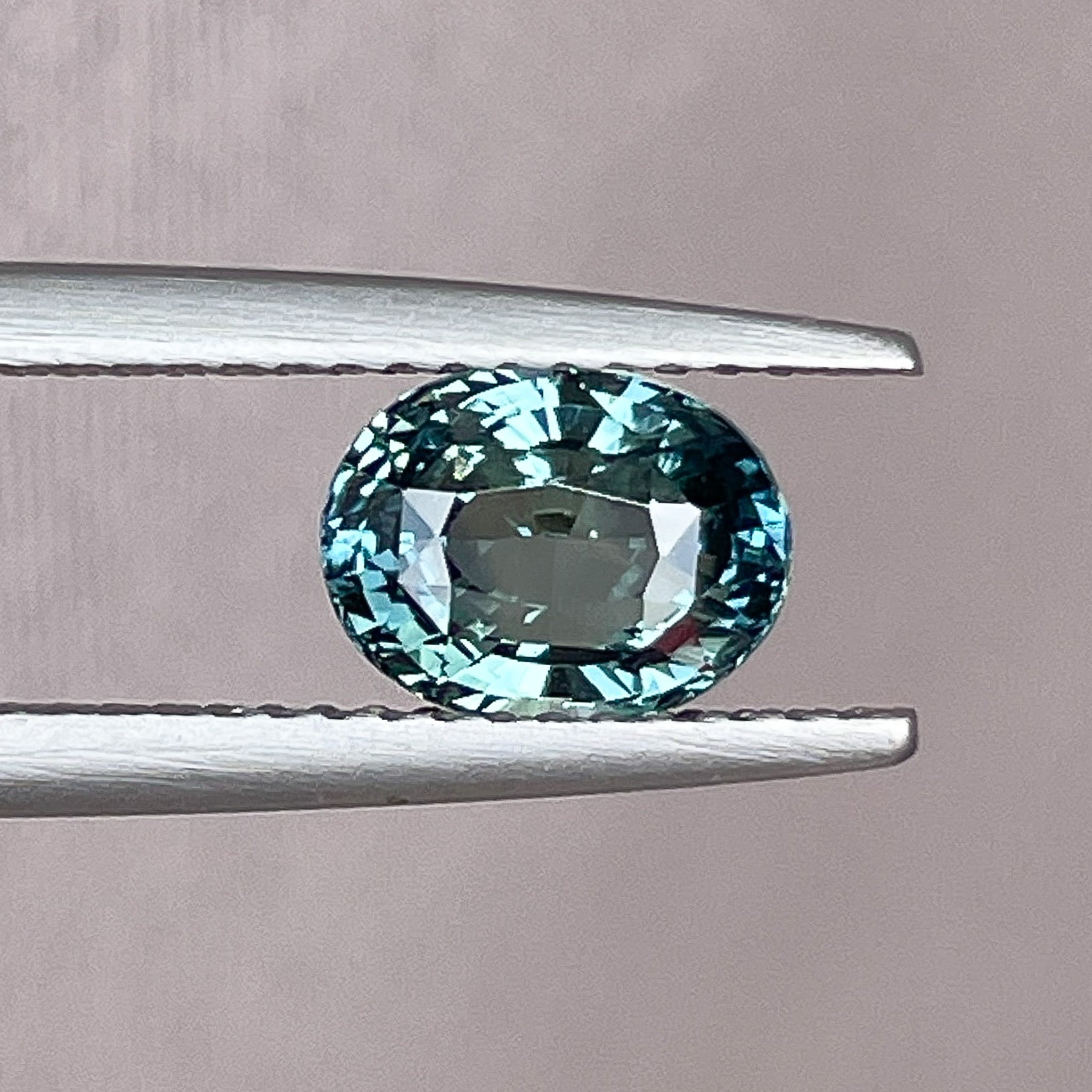 Natural teal blue-green sapphire, 2.03 Ct oval cut loose gemstone from NASHGEMS for engagement or custom jewelry.