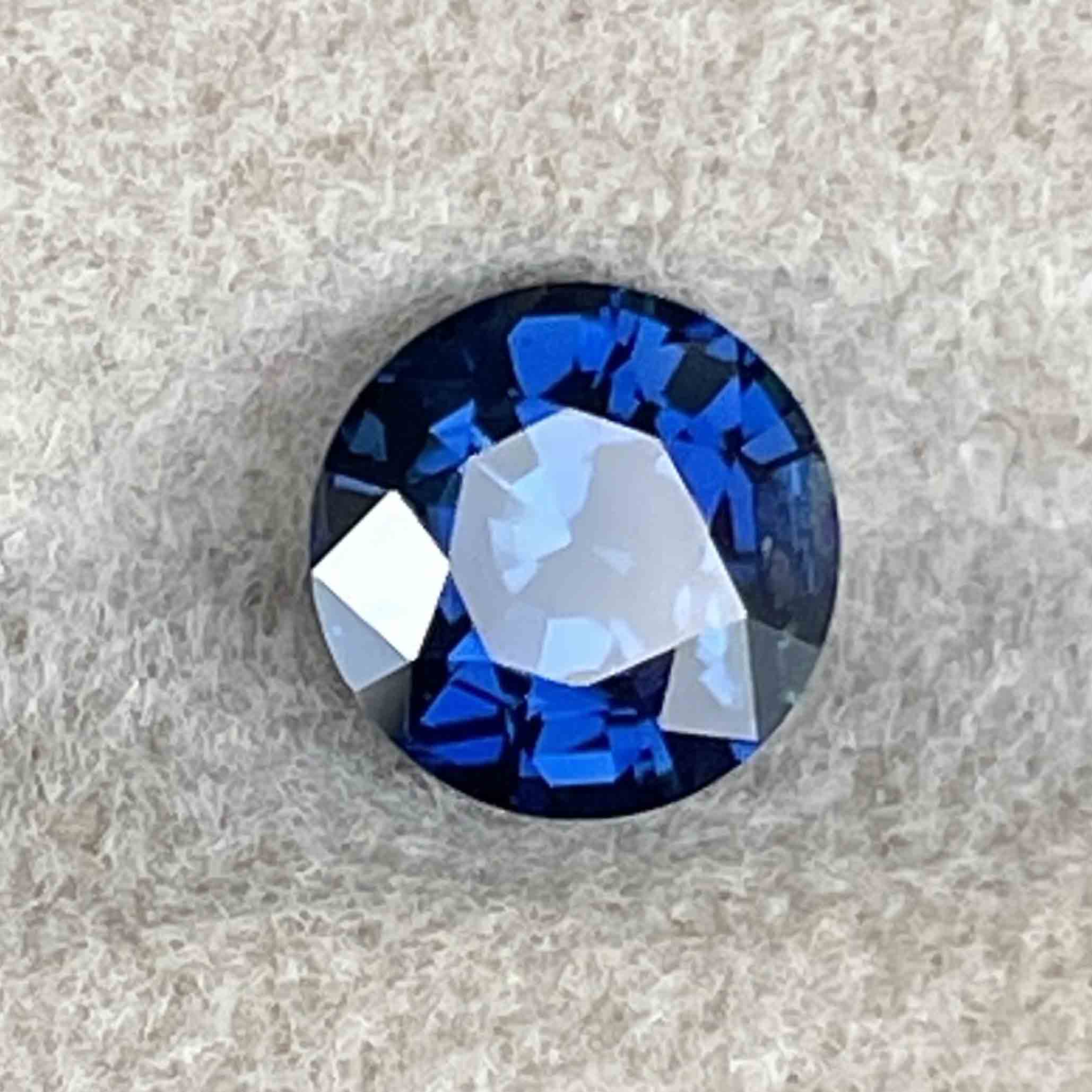 Natural blue sapphire loose gemstone, 1.16 Ct round cut, heat treated, ideal for engagement rings or custom jewelry.