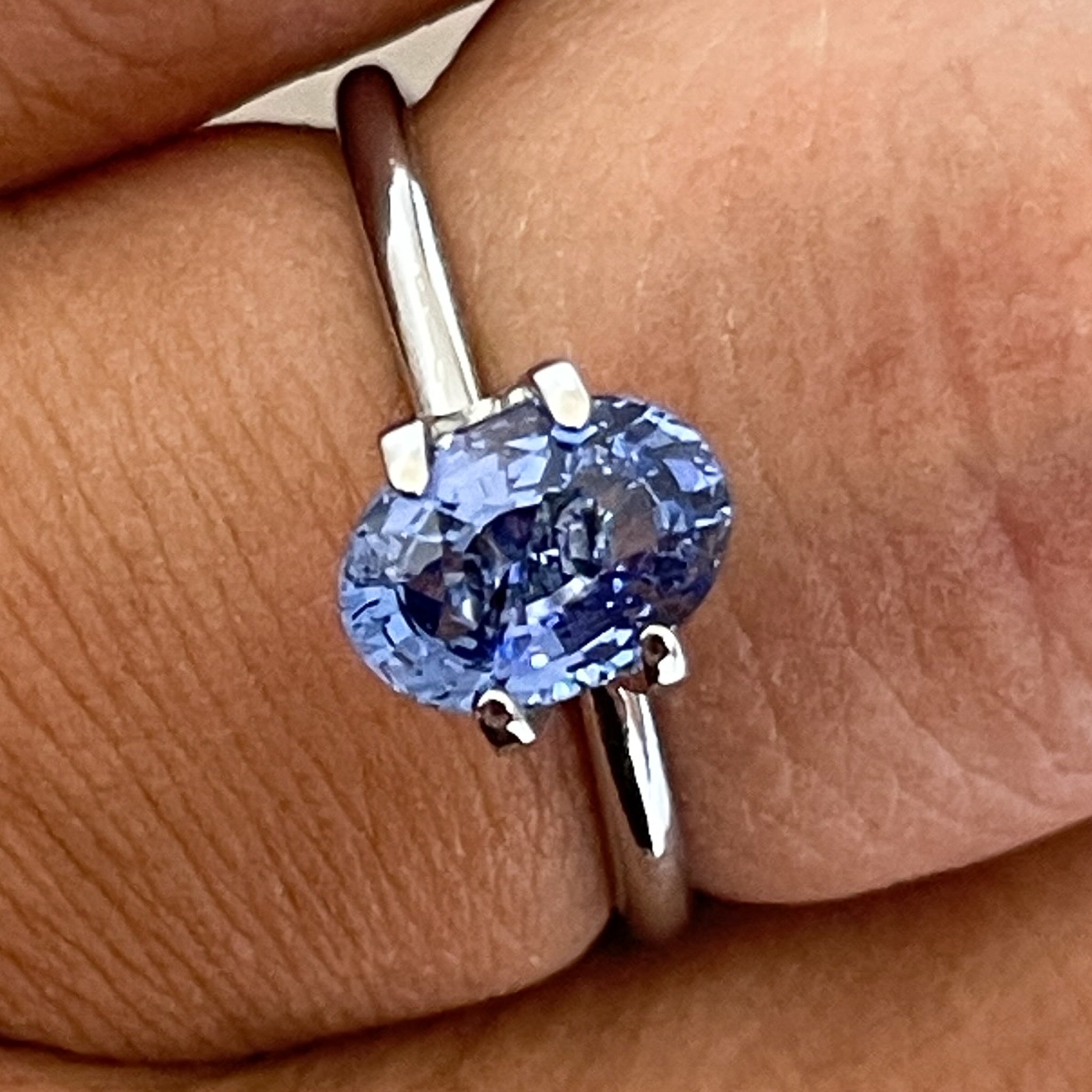 Natural Ceylon Blue Sapphire 1.54 Ct oval cut loose gemstone by NASHGEMS for engagement rings, showcasing vibrant blue color and clarity.