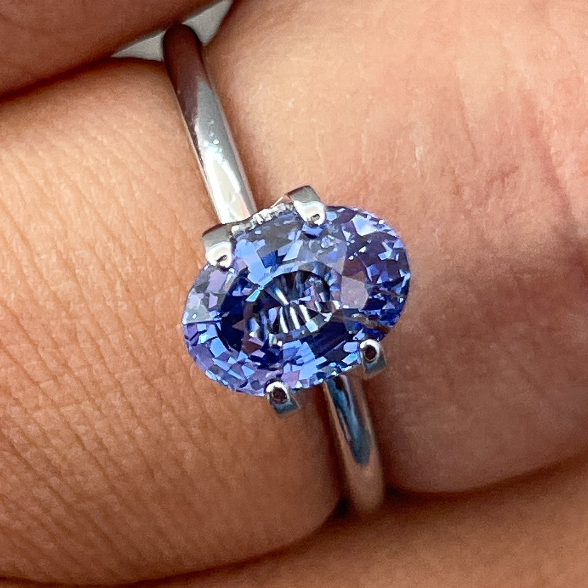 Natural Ceylon Blue Sapphire 1.54 Ct loose oval cut gemstone by NASHGEMS, showcasing deep blue color and polished surface.