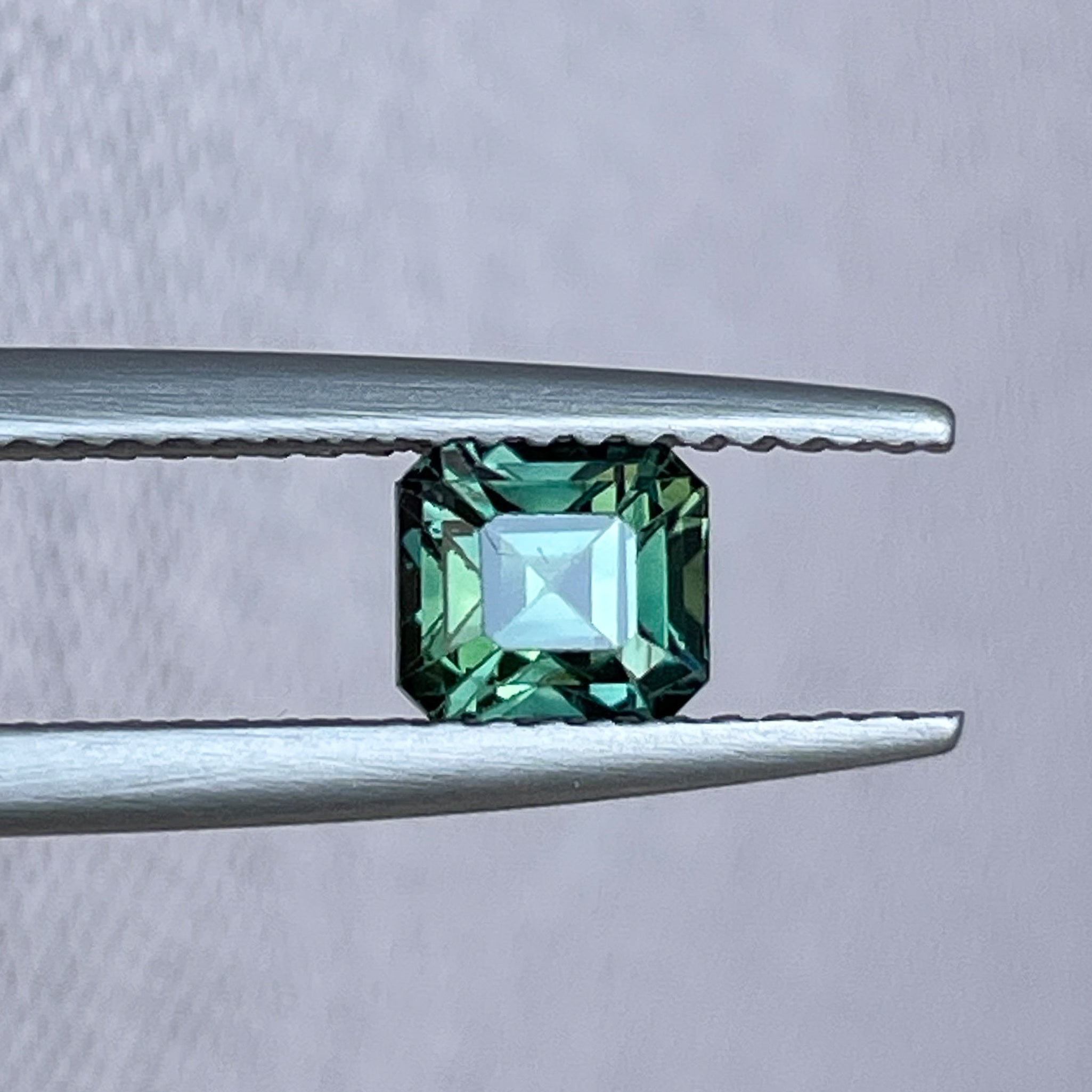 Teal natural forest green sapphire 1.09 Ct loose emerald cut gemstone by NASHGEMS, ideal for engagement rings or custom jewelry.