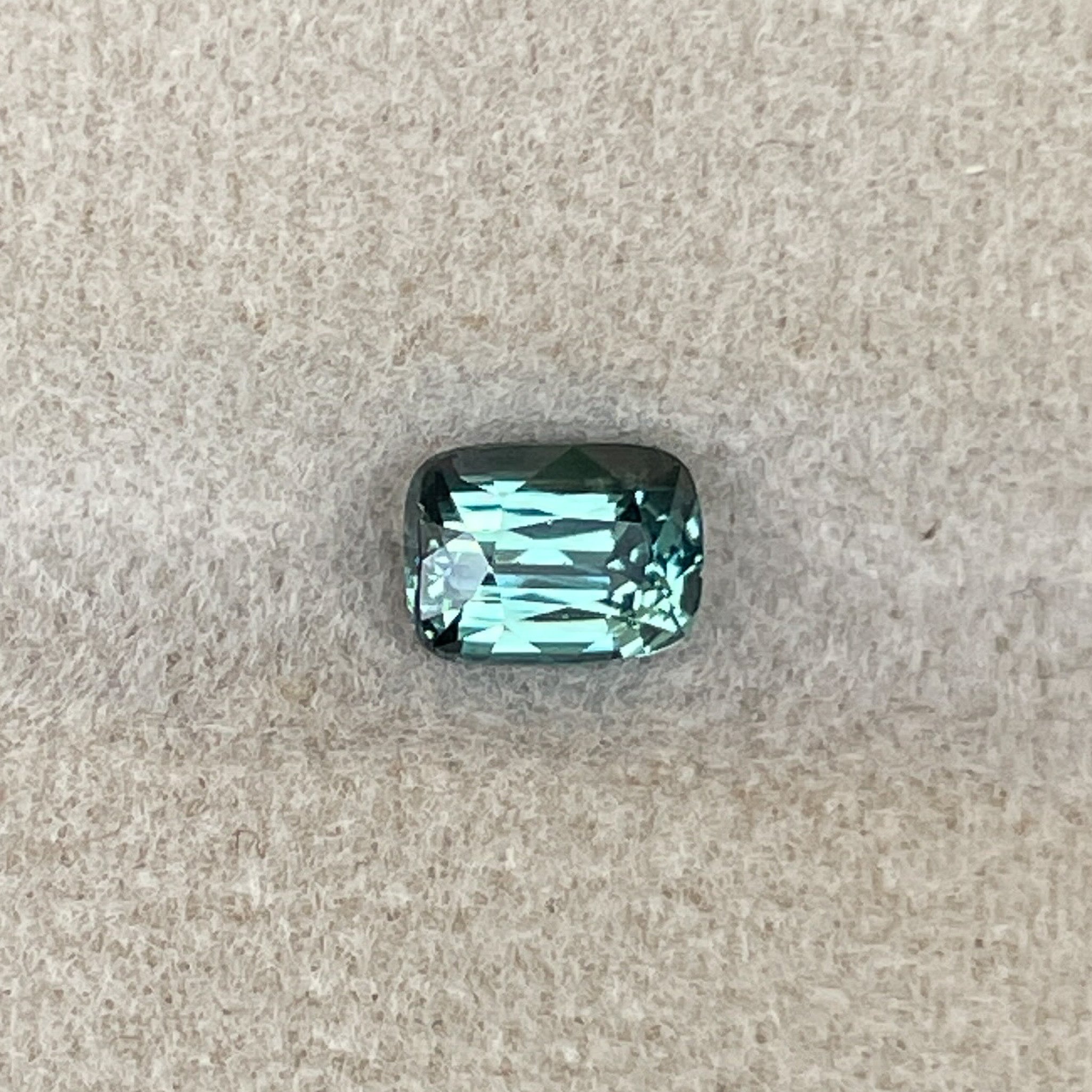 Natural teal green sapphire 1.03 Ct cushion cut loose gemstone from NASHGEMS, ideal for engagement rings or custom jewelry.