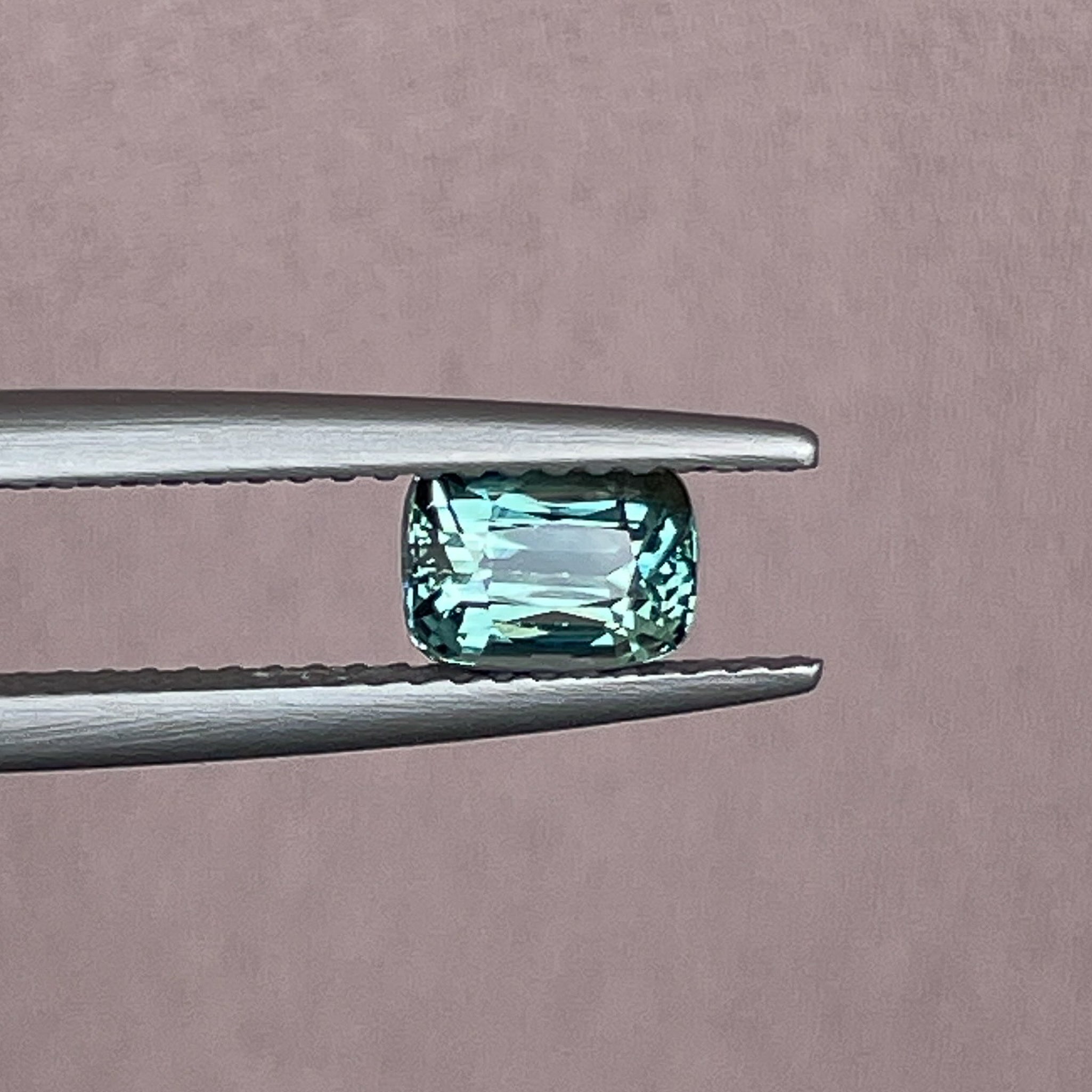 Natural teal green sapphire 1.03 Ct cushion cut loose gemstone by NASHGEMS, ideal for engagement rings or custom jewelry.