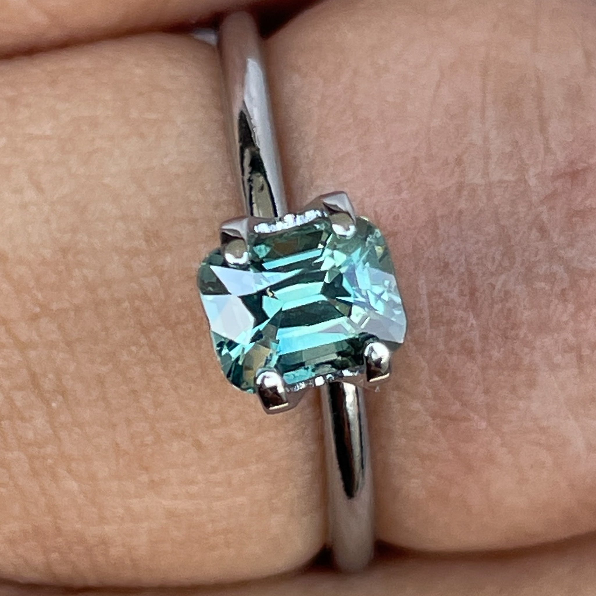 Natural teal green sapphire 1.11 ct cushion cut loose gemstone from NASHGEMS, perfect for engagement rings or custom jewelry.