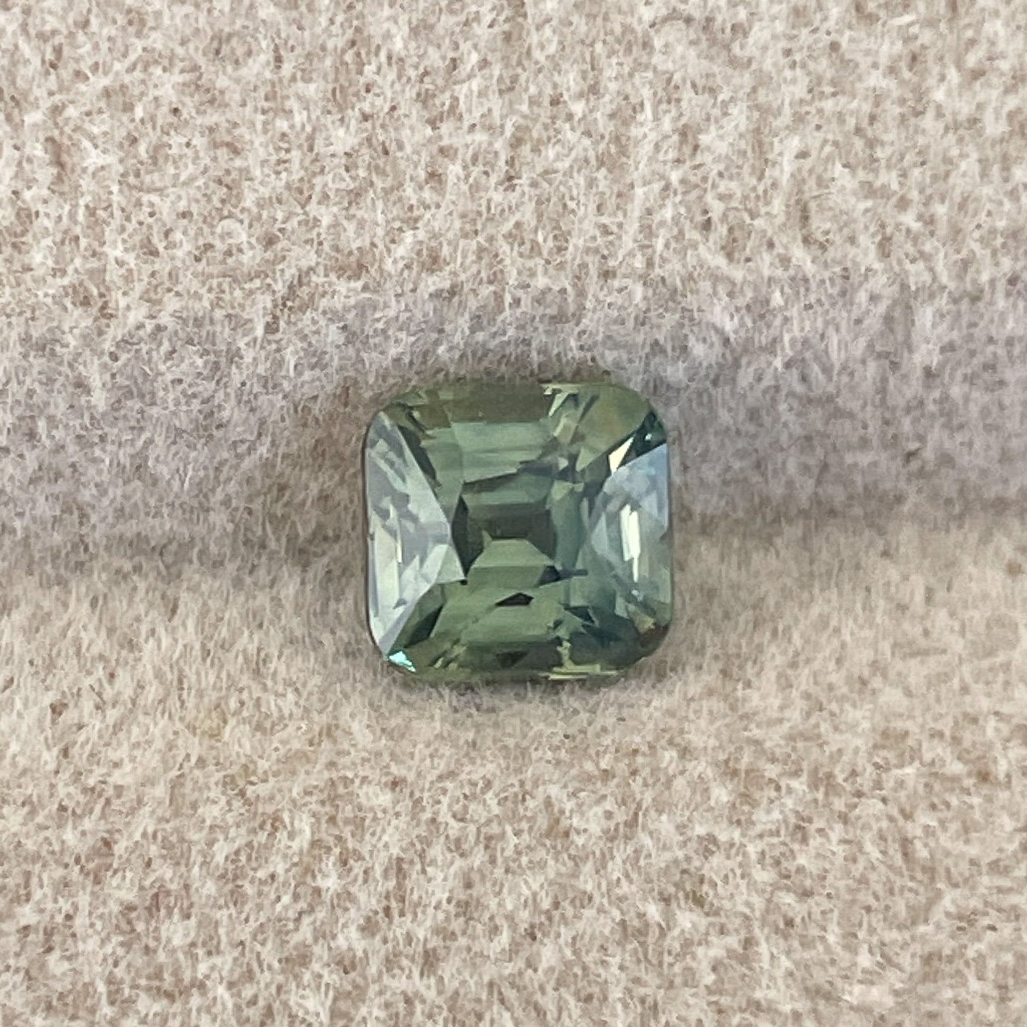 Natural pale green teal sapphire, 1.06 ct cushion cut loose stone by NASHGEMS, ideal for engagement or custom jewelry.
