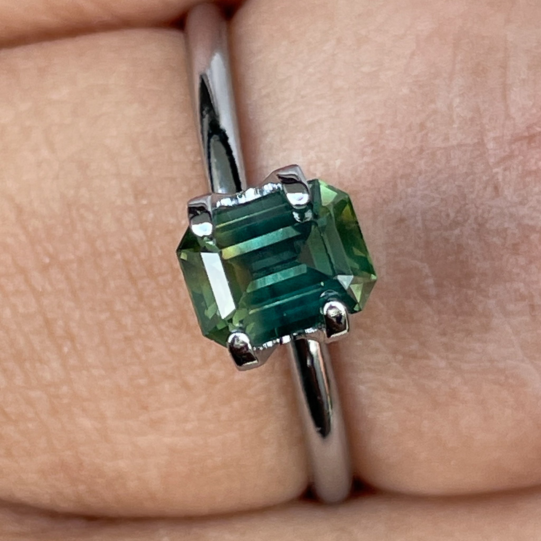 Natural NASHGEMS teal bi-color sapphire, 1.13 ct emerald cut loose gemstone for engagement or custom jewelry, no heat treatment.