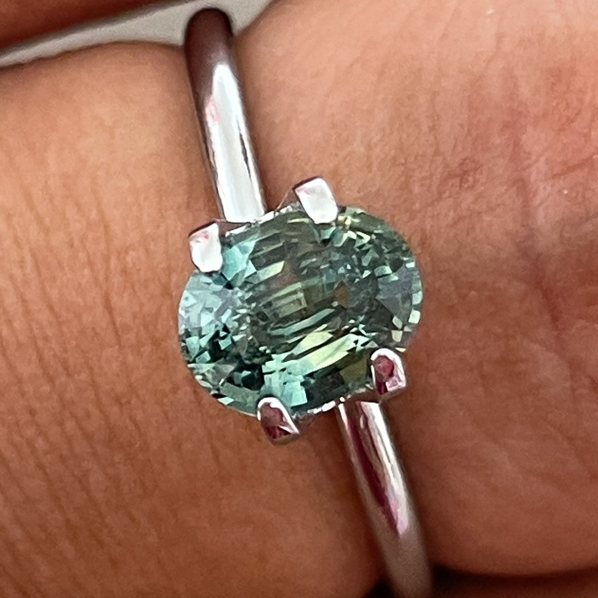 Natural teal green sapphire, 1.45 Ct oval cut loose gemstone by NASHGEMS, perfect for engagement rings or custom jewelry.