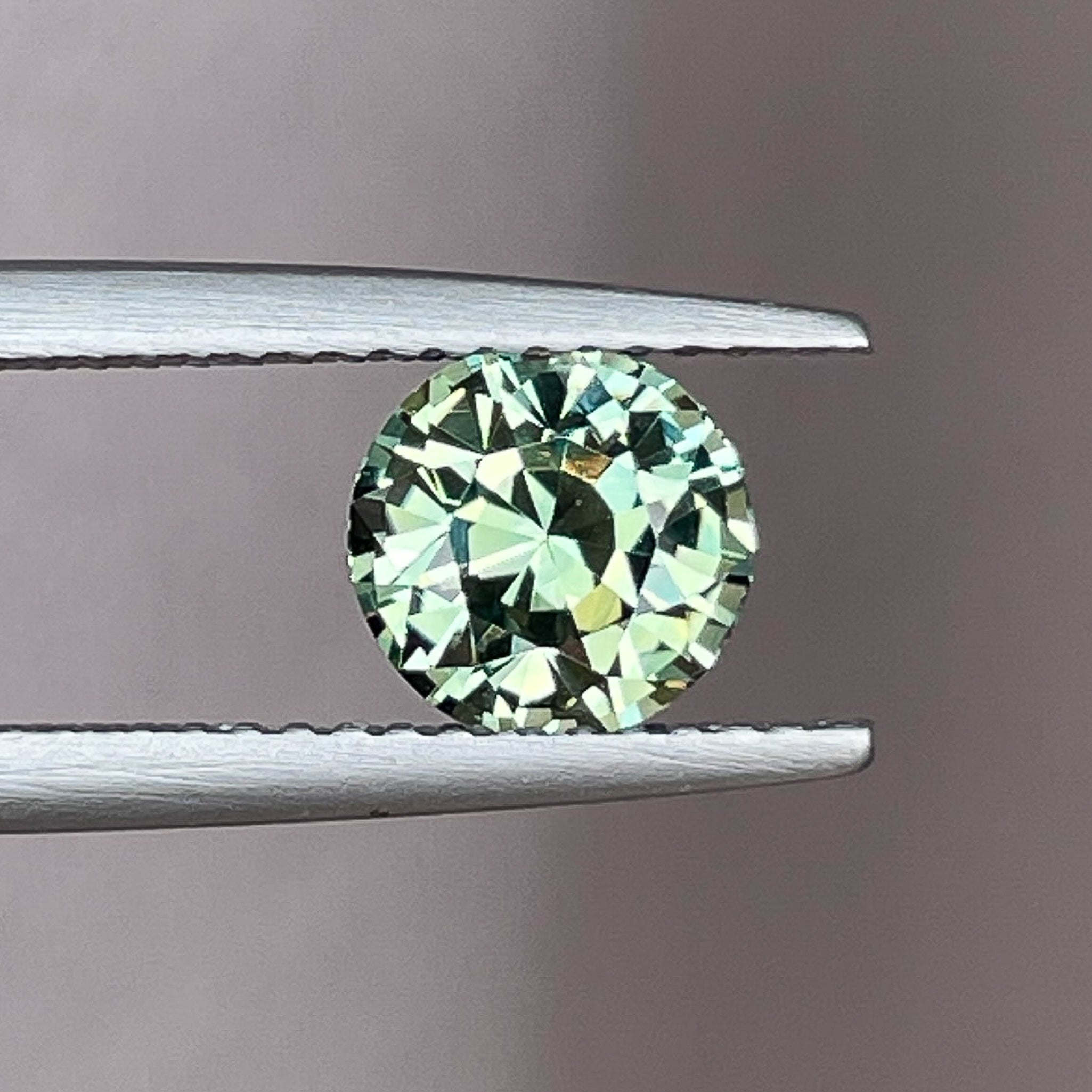 Natural pale green teal sapphire 1.90 Ct round cut loose gemstone from NASHGEMS, ideal for engagement rings or custom jewelry.