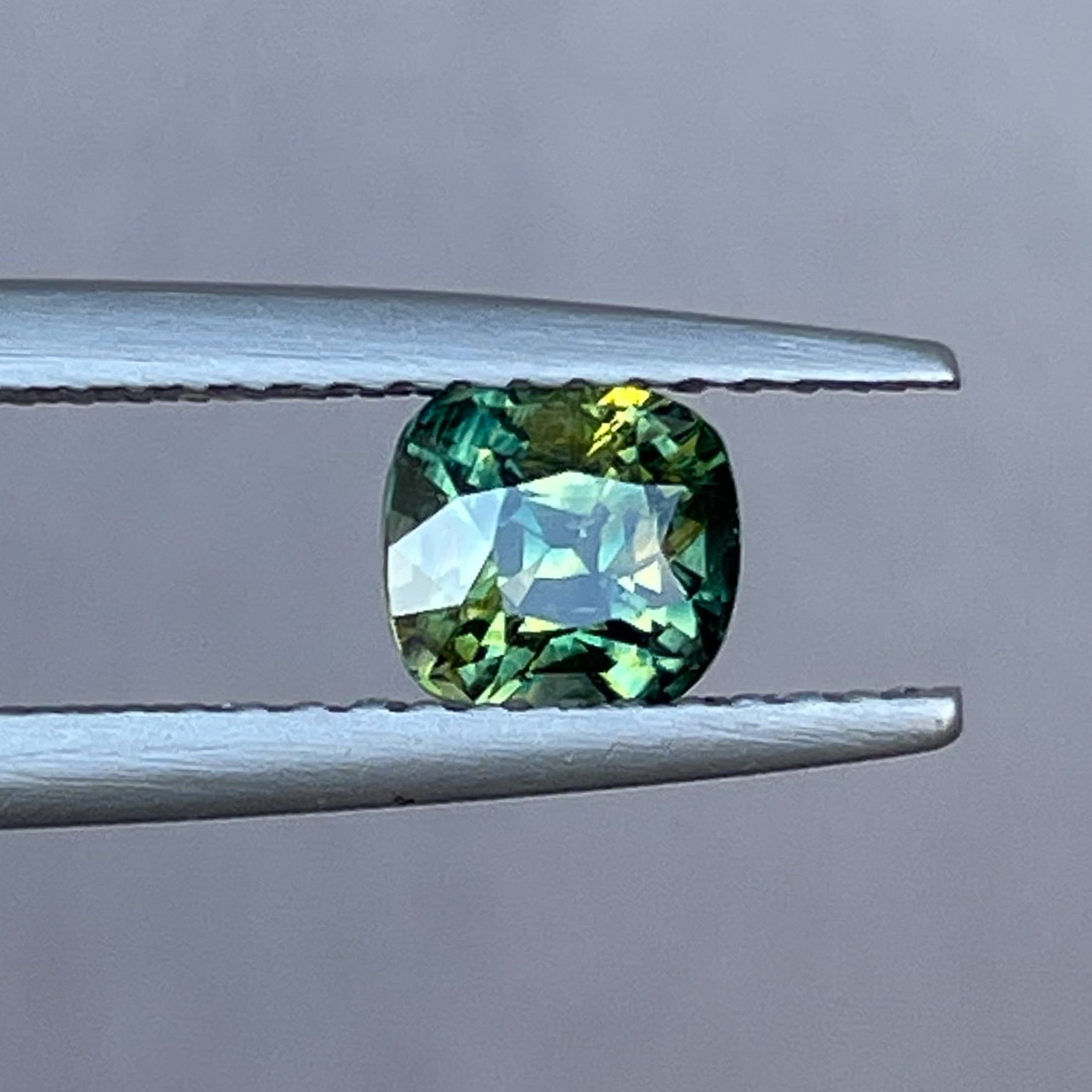 Natural Australian teal Parti Sapphire 1.10 Ct cushion cut loose gemstone by NASHGEMS, ideal for engagement or custom jewelry.