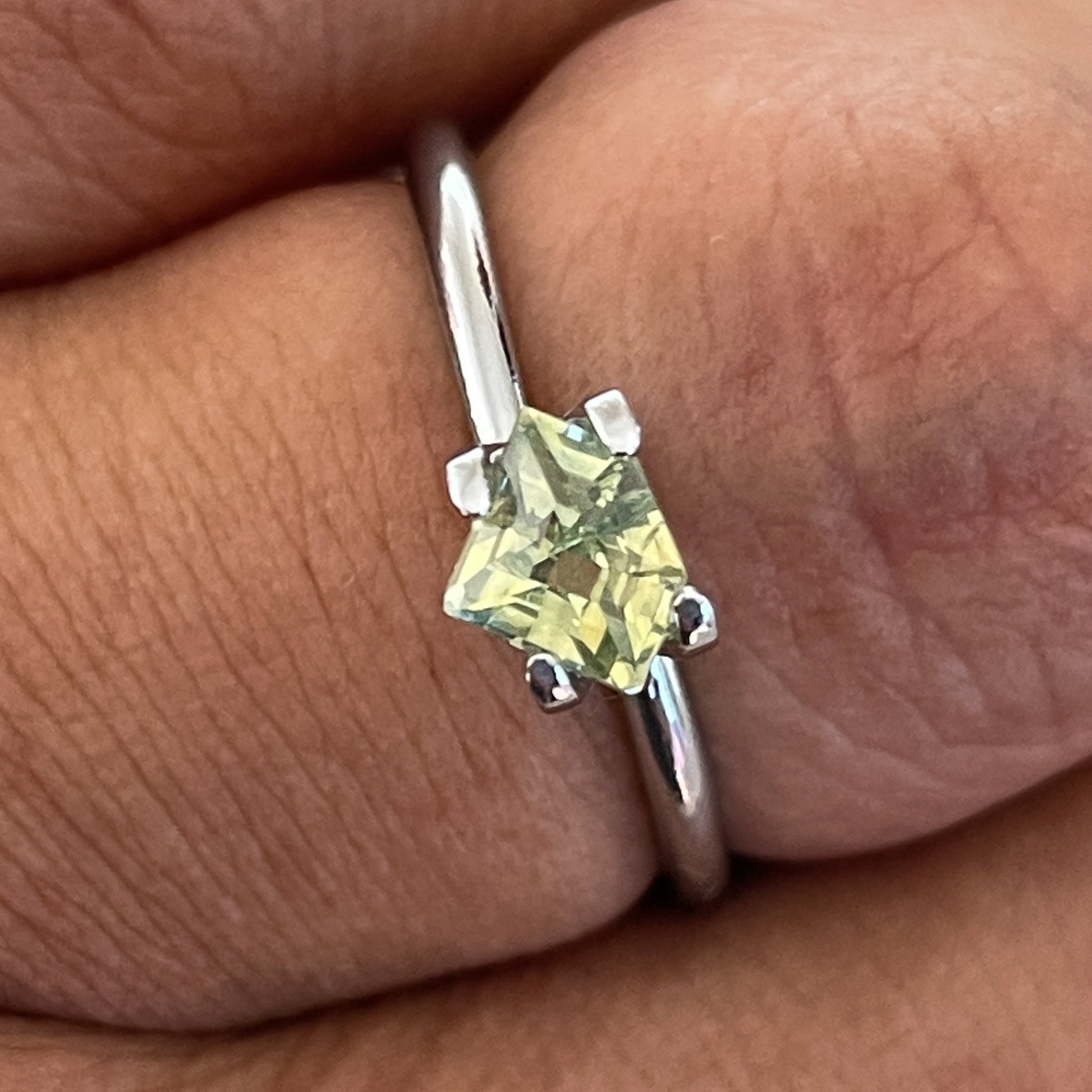 Natural pale green yellow sapphire, 0.72 ct shield cut loose teal sapphire by NASHGEMS for engagement or custom jewelry.