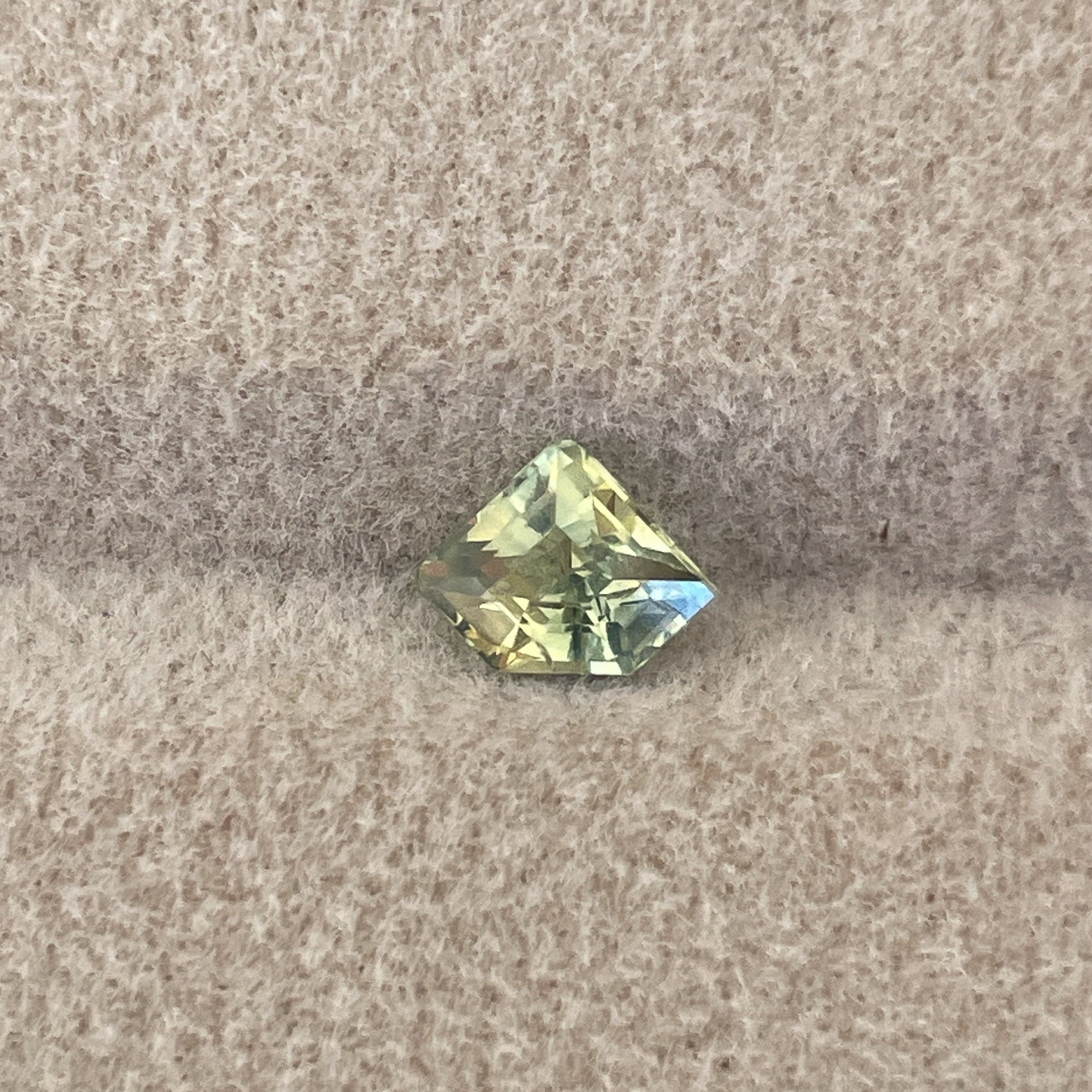 Natural pale green yellow sapphire, 0.72 ct shield cut loose teal sapphire for engagement or custom jewelry by NASHGEMS.