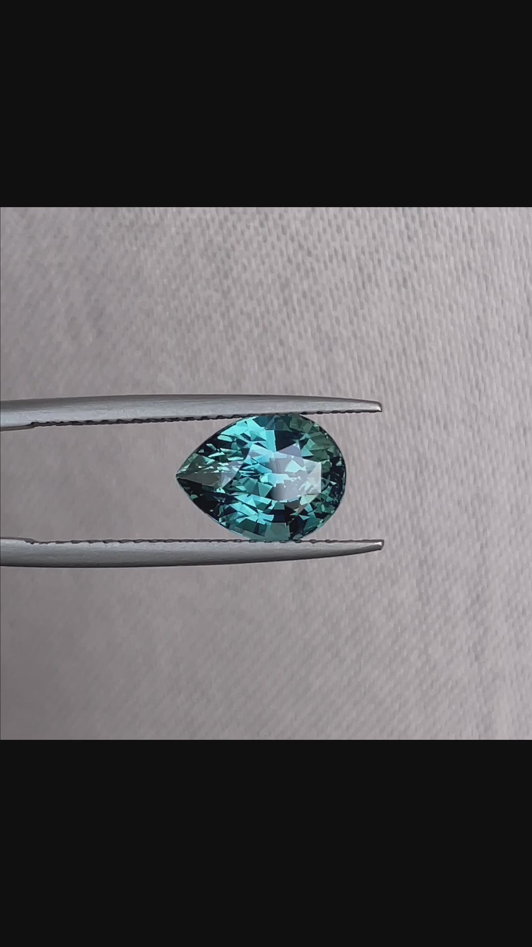 teal blue green parti sapphire pear drop cut gem