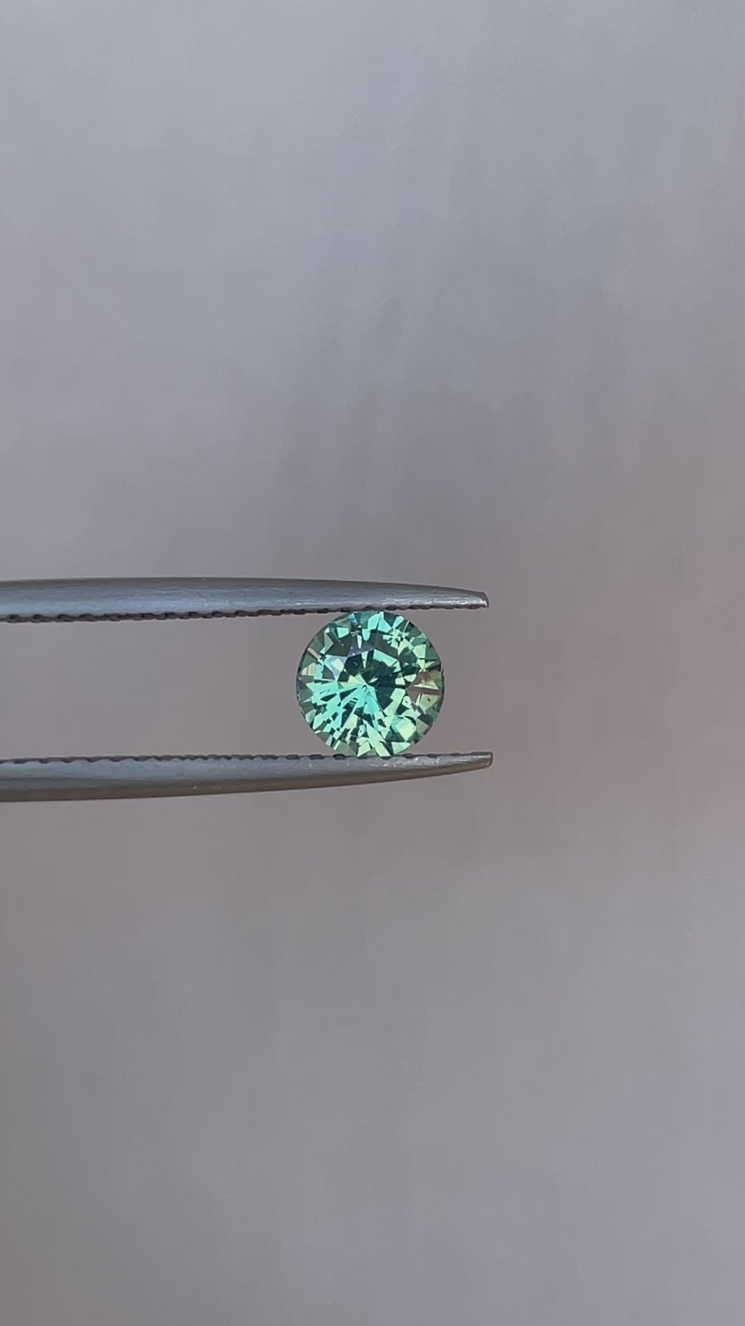 teal blue green parti sapphire round cut gem