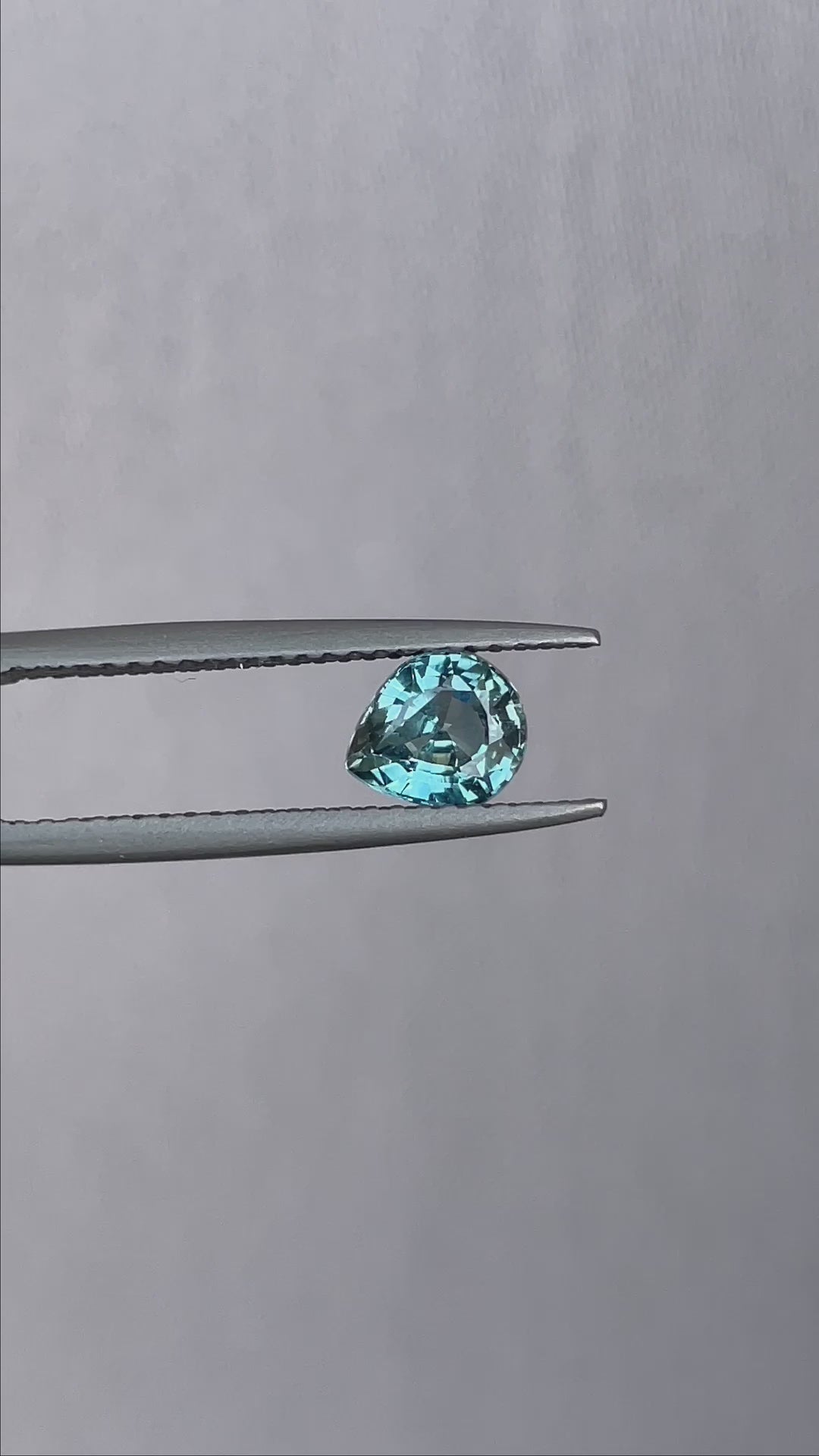 teal blue green parti sapphire pear drop cut gem