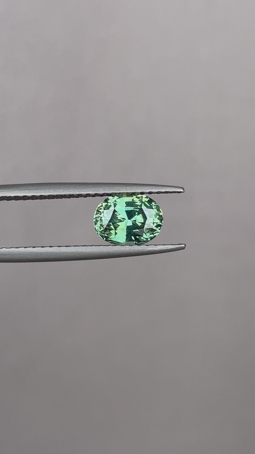 teal blue green parti sapphire oval cut gem
