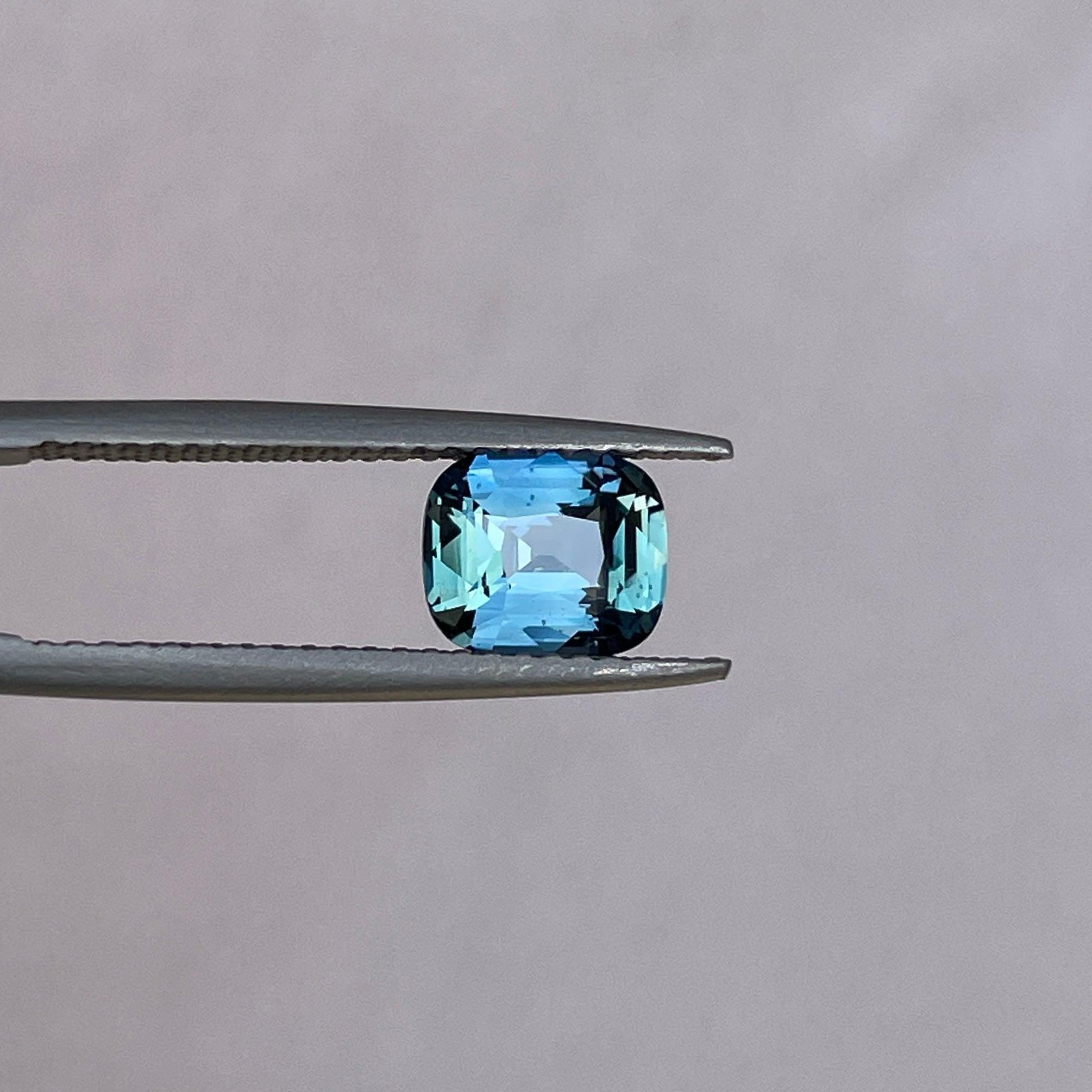 teal blue green parti sapphire cushion cut gem