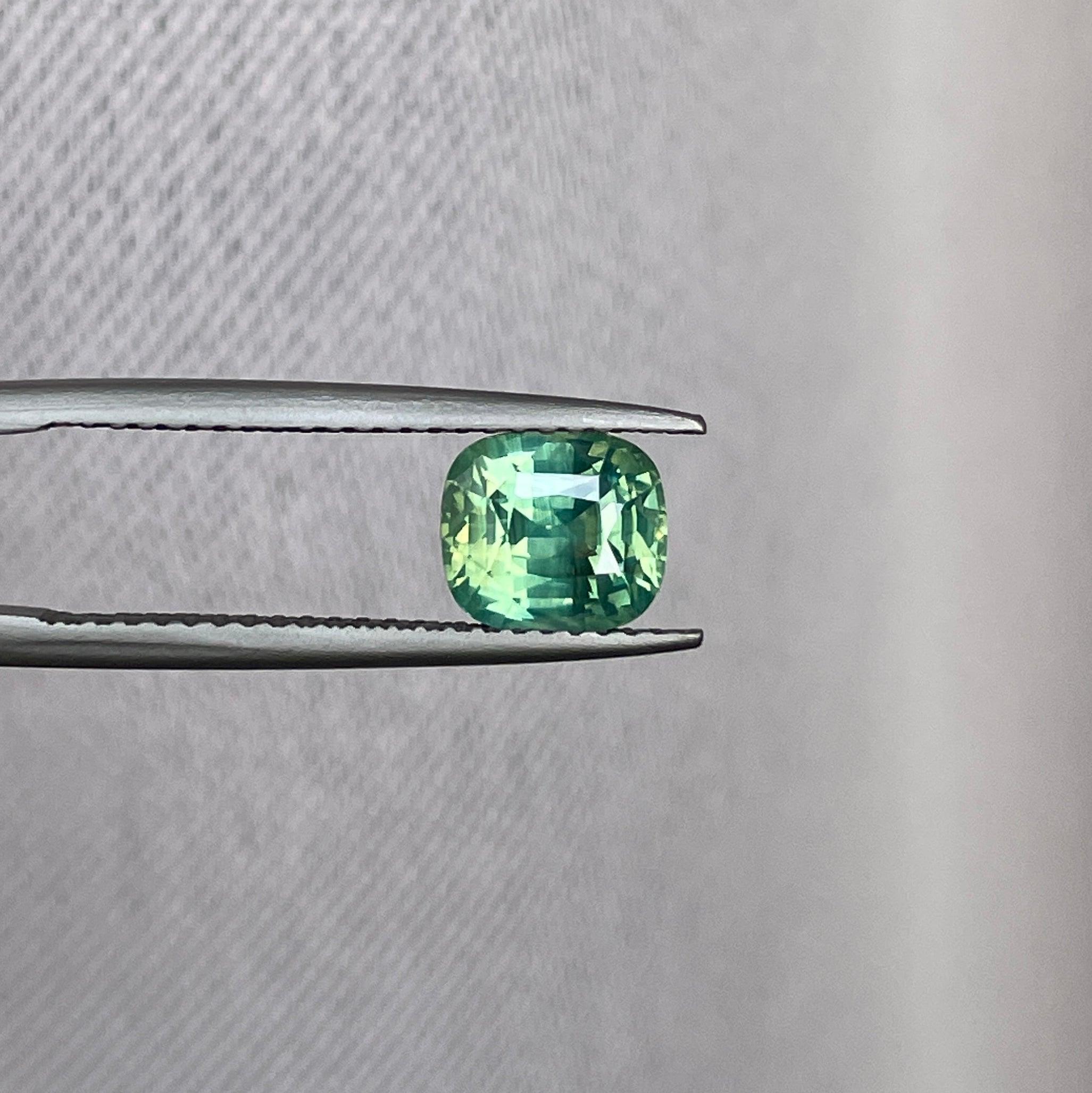 teal blue green parti sapphire cushion cut gem