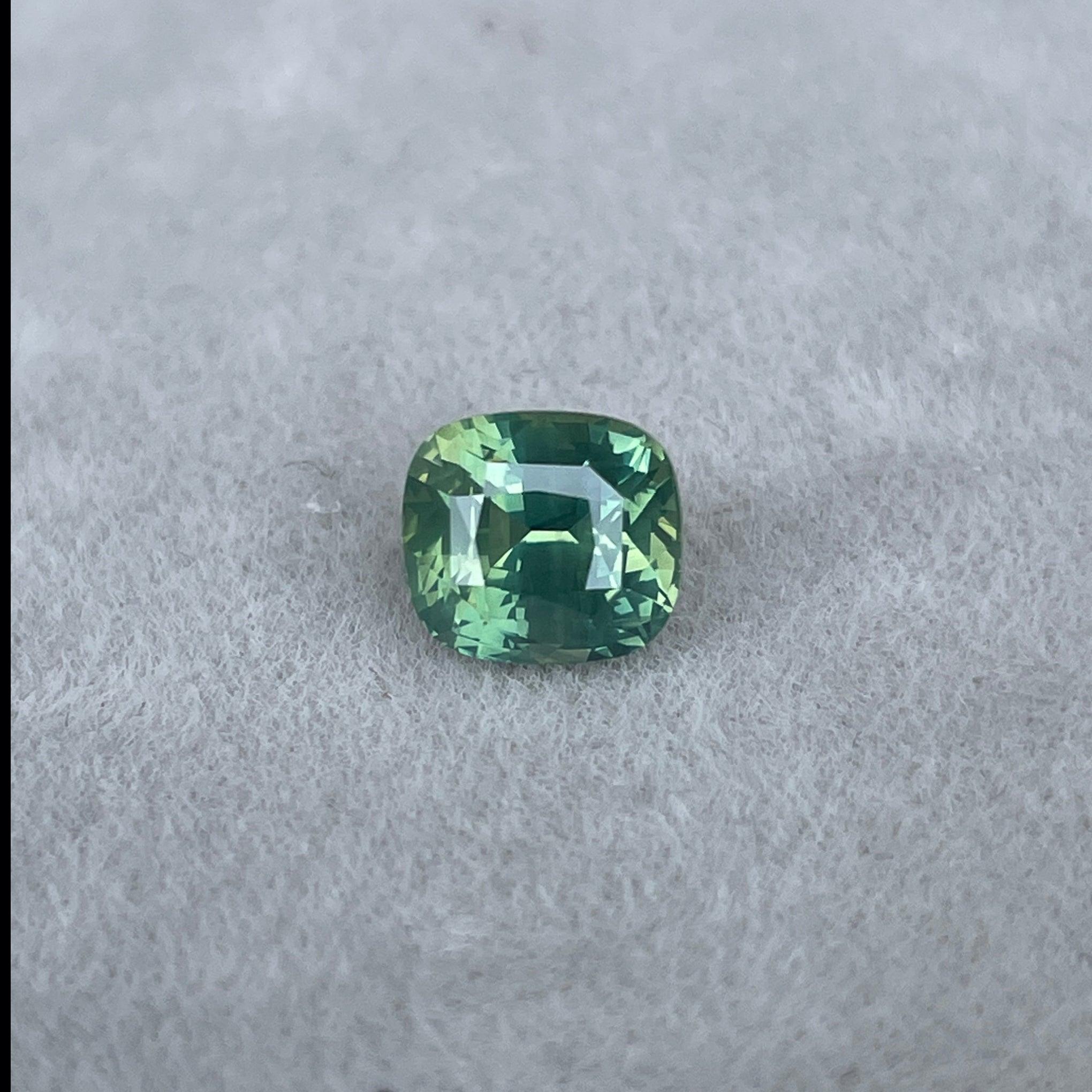 teal blue green parti sapphire cushion cut gem