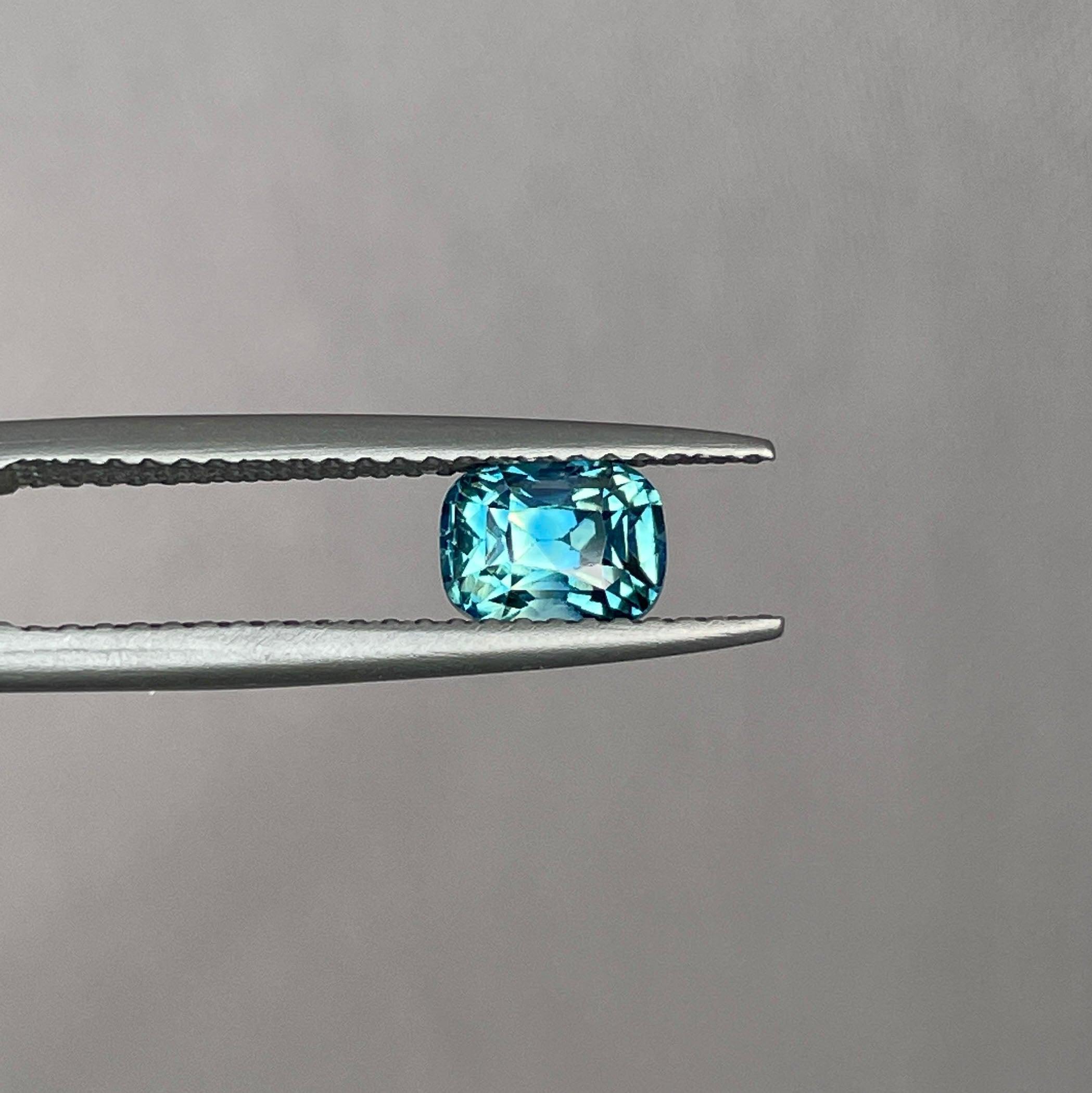 teal blue green parti sapphire cushion cut gem