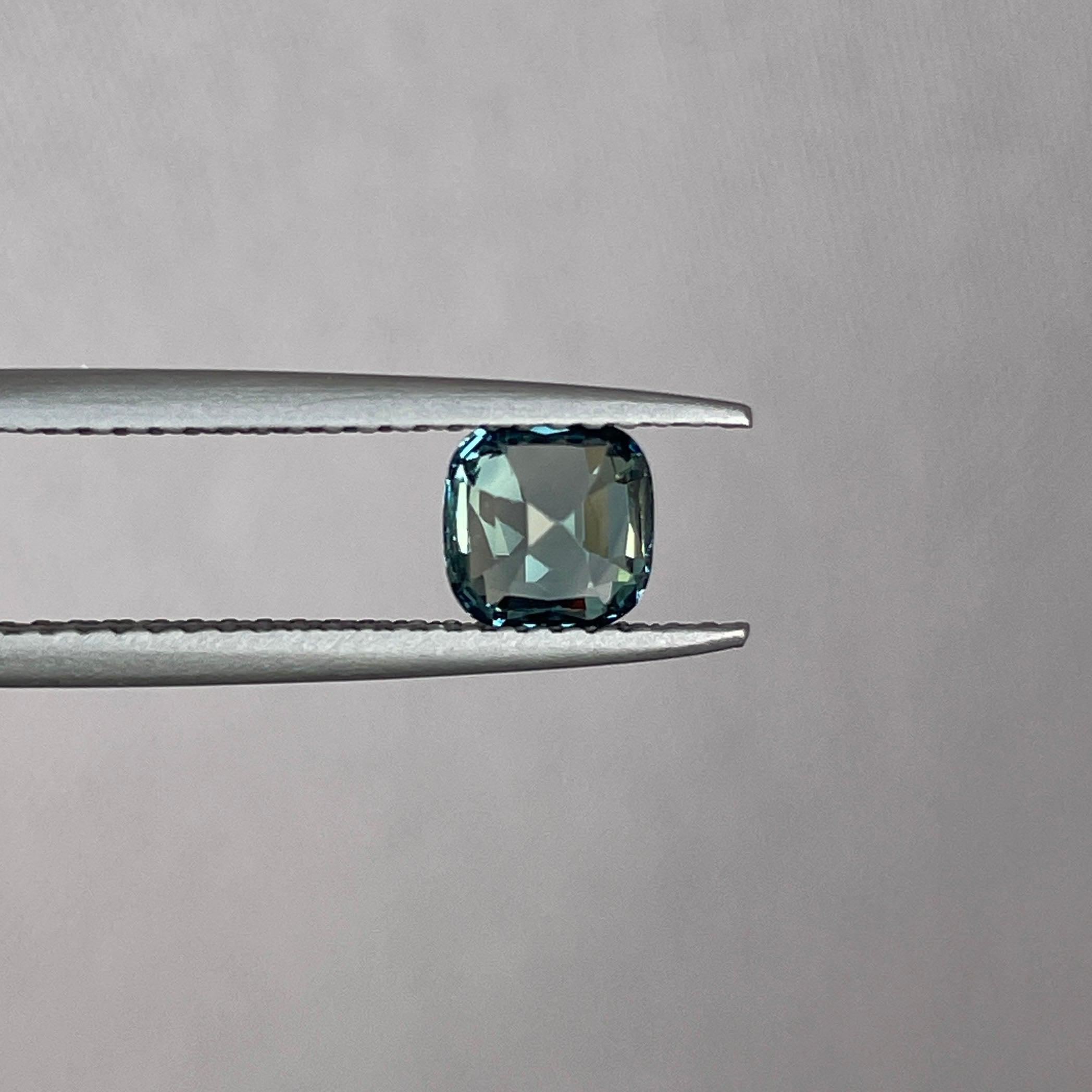 teal blue green parti sapphire cushion cut gem